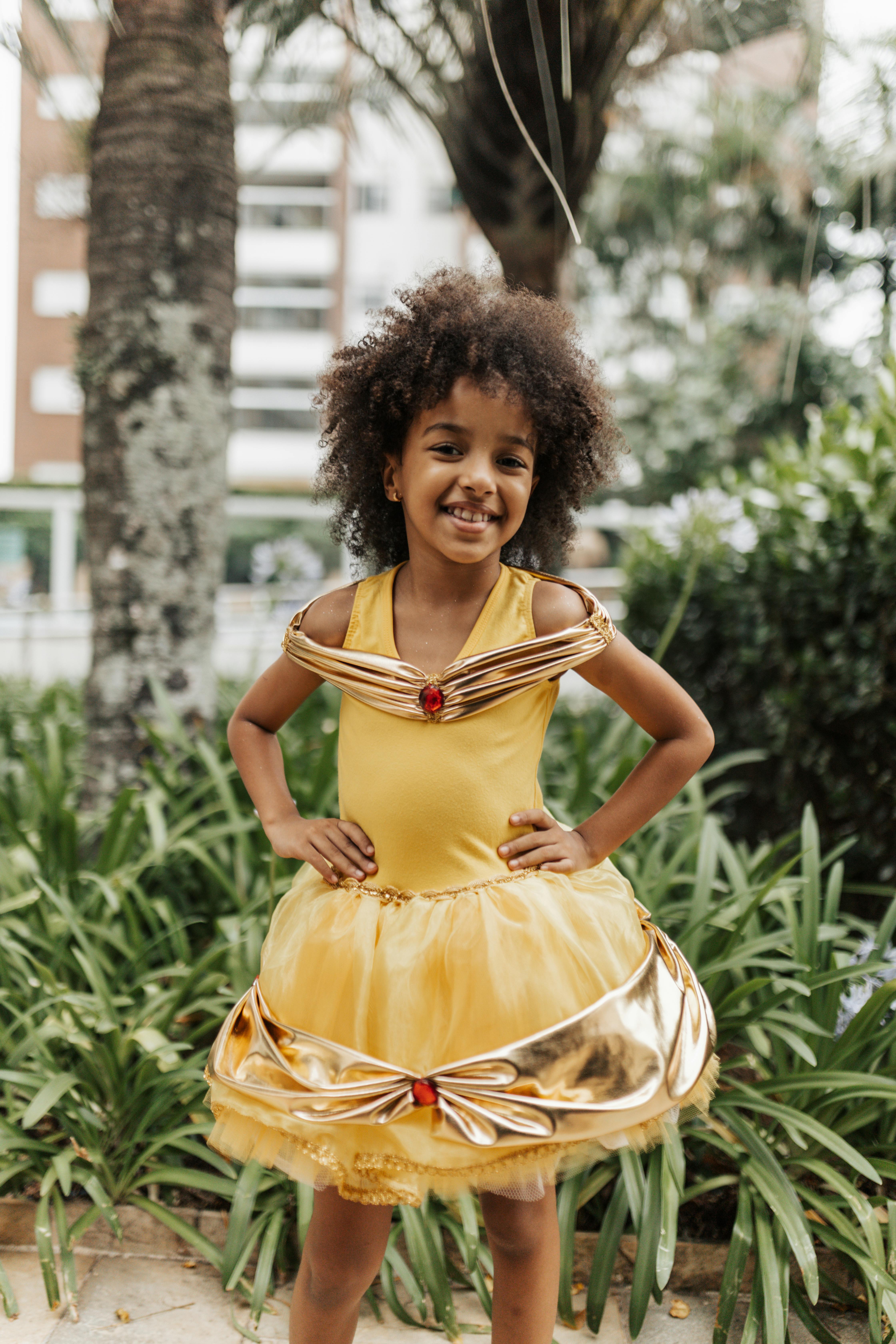 A little girl showing off her dress | Source: Pexels