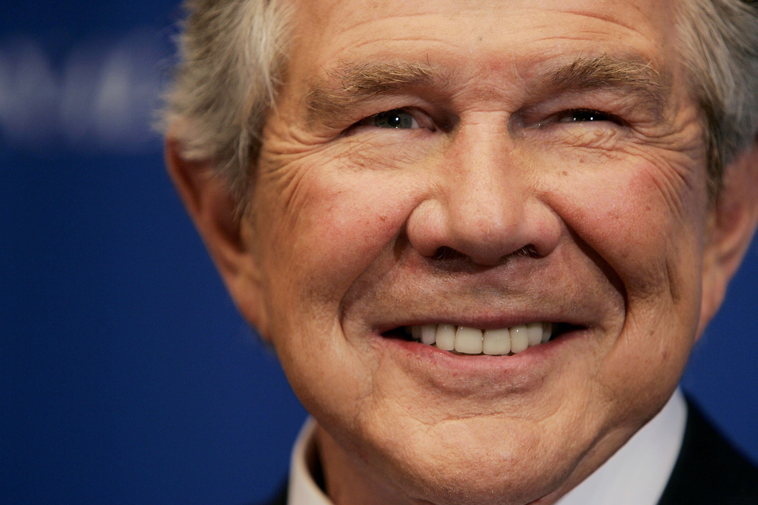 Pat Robertson, founder of CBN, smiles as he is introduced before speaking at the National Press Club on February 15, 2005 in Washington, DC. | Photo: Getty Images