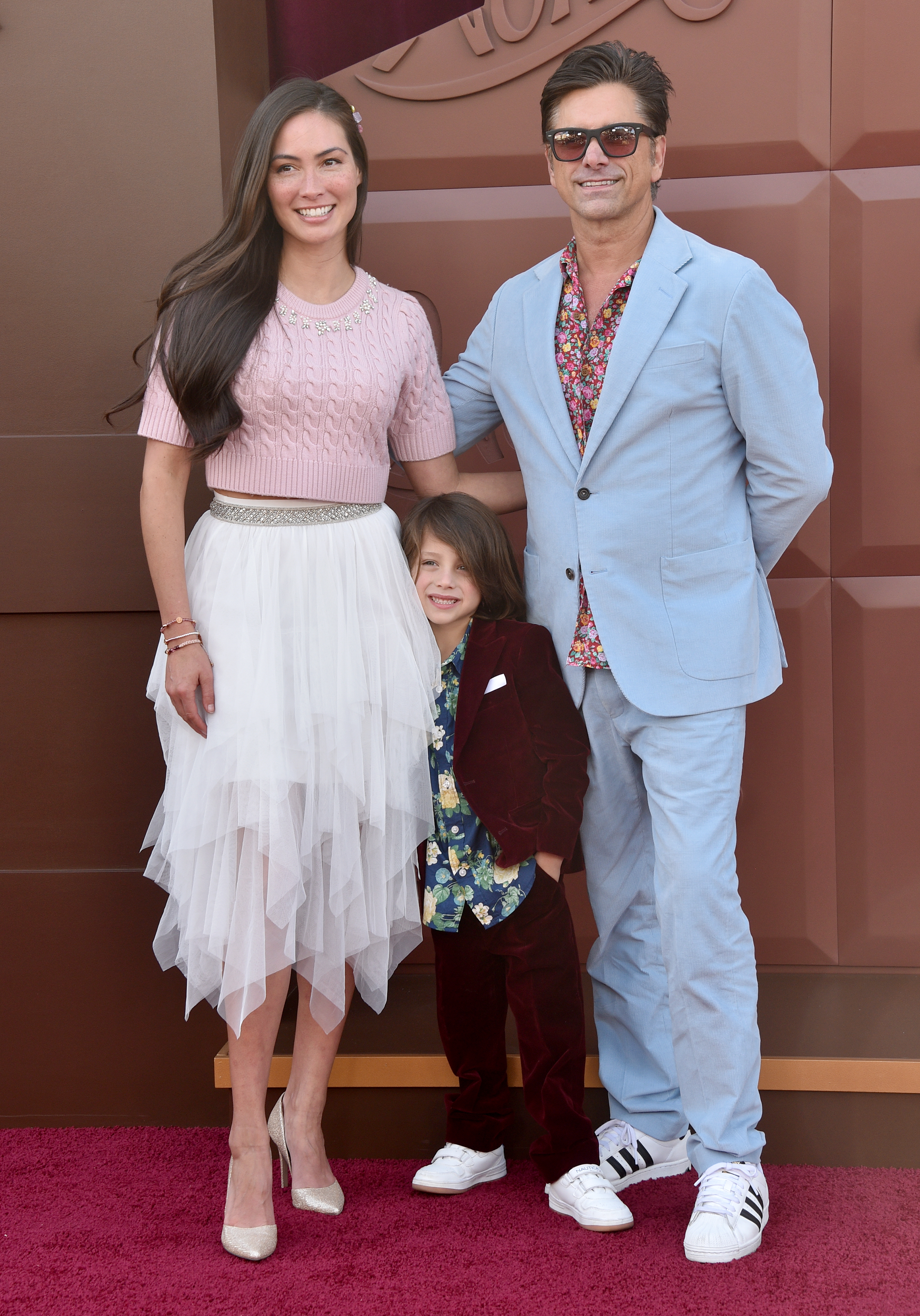 Caitlin McHugh, Billy Stamos, and John Stamos at the "Wonka" premiere in Los Angeles, California on December 10, 2023 | Source: Getty Images