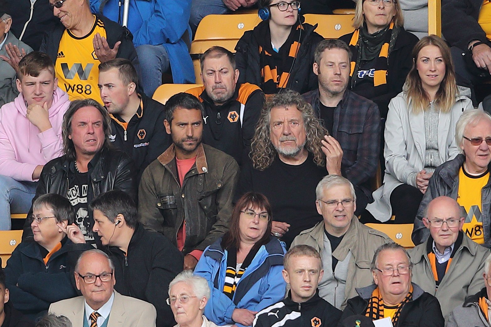 Logan Plant and Robert Plant in the middle of the seating area during a Premier League match on August 25, 2018 in Wolverhampton |  Source: Getty Images
