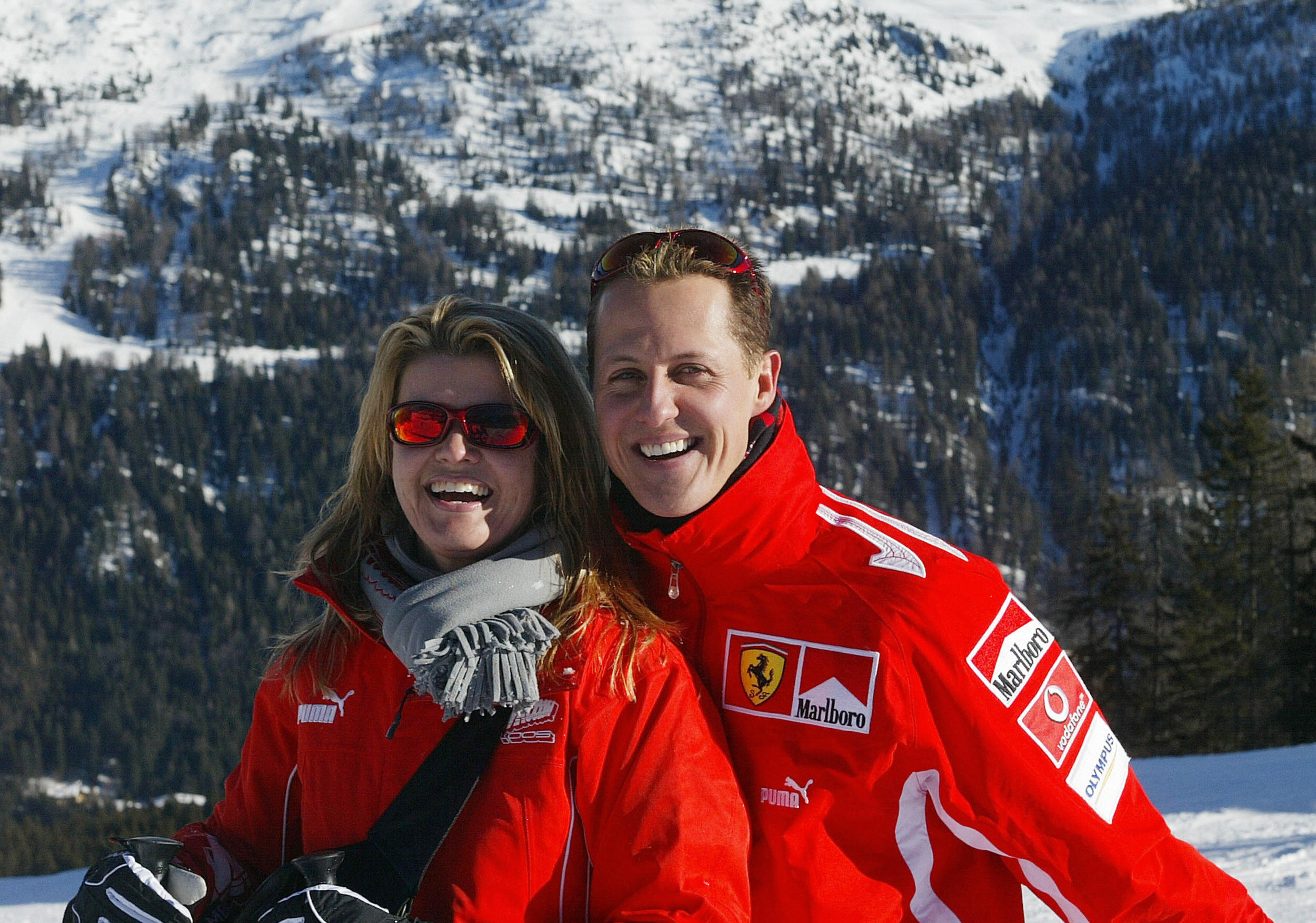 Michael Schumacher poses with his wife Corinna Schumacher, in the winter resort of Madonna di Campiglio, in the Dolomites area, Northern Italy, January 11, 2005. | Source: Getty Images
