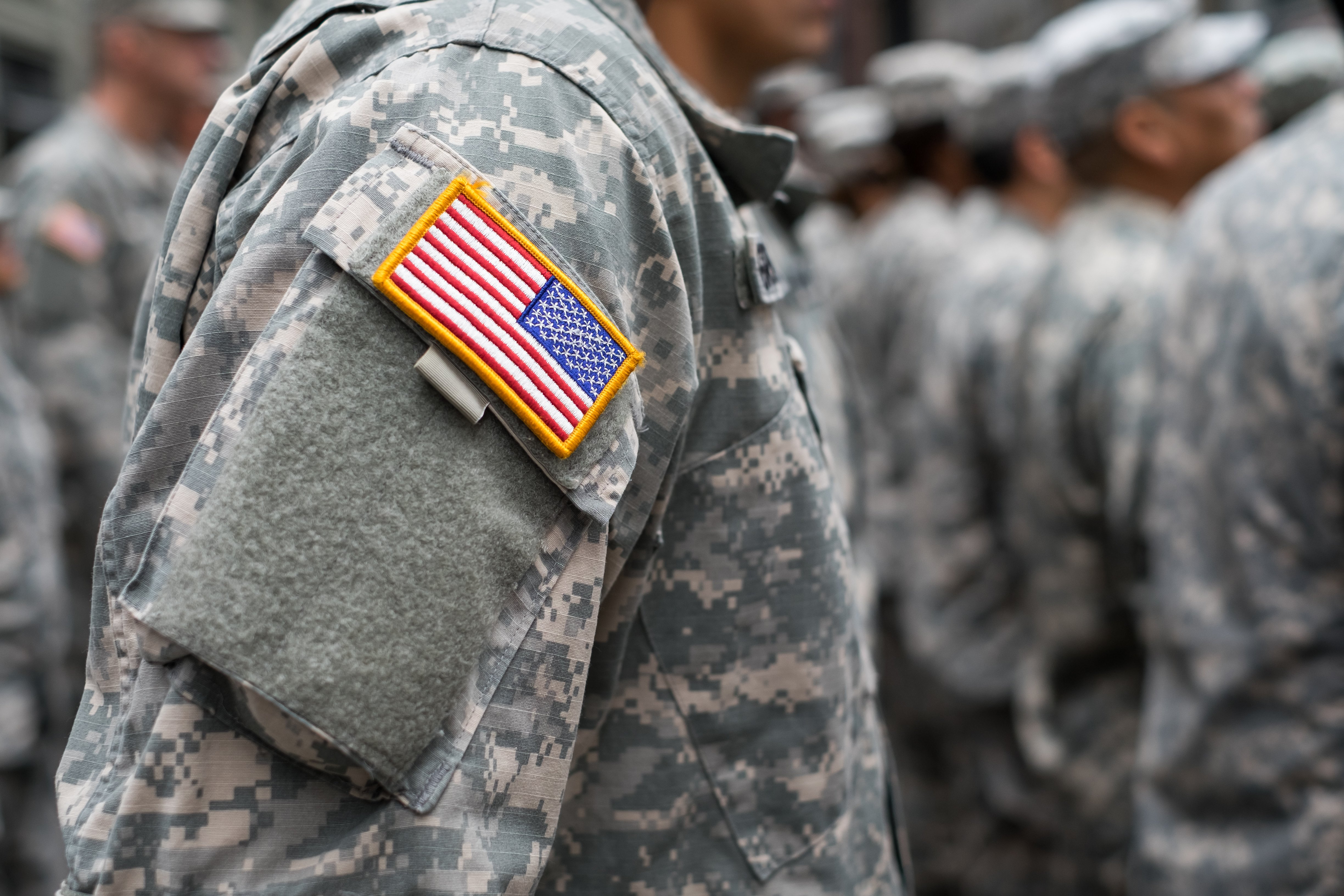USA patch flag on soldiers arm | Photo: Shutterstock