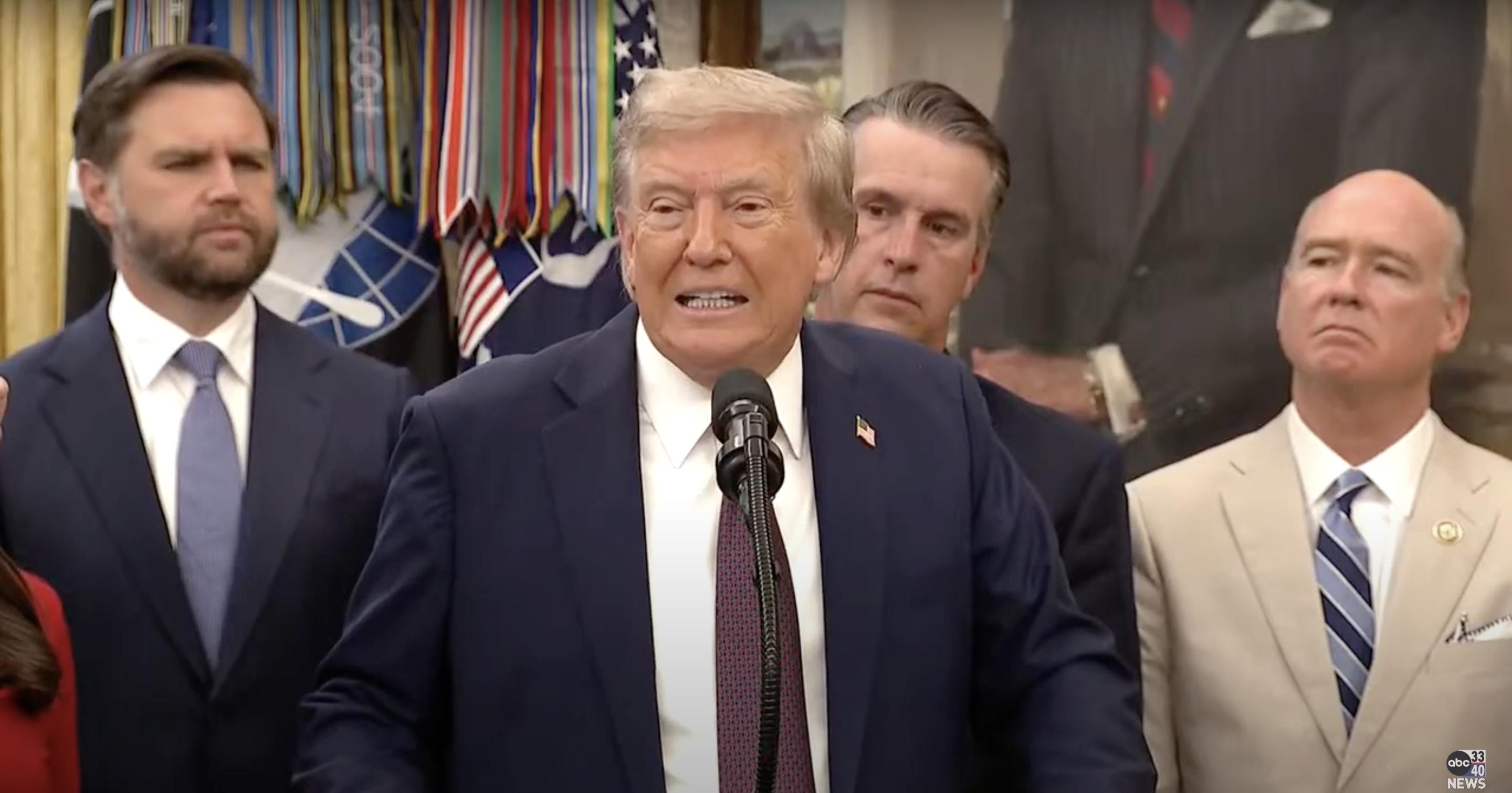 President Donald Trump speaks with a tense expression during a press conference, as officials look on | Source: YouTube/abc3340
