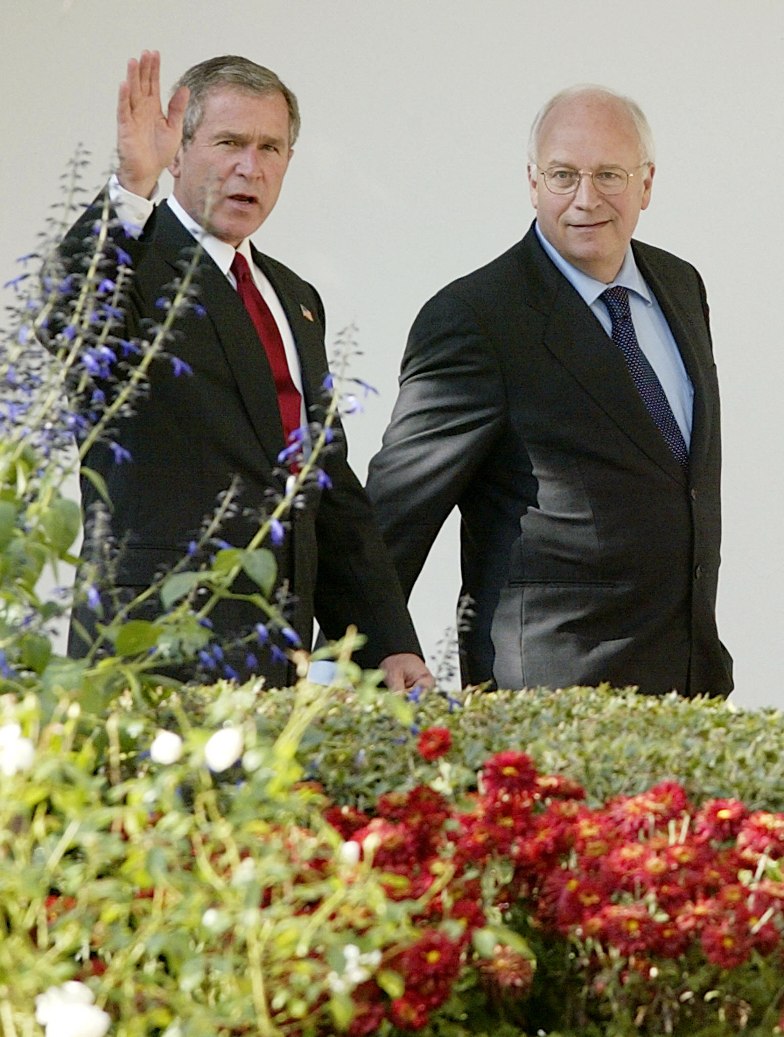 US President George W. Bush walks with Vice President Dick Cheney at the White House on October 29, 2003, in Washington, D.C. | Source: Getty Images