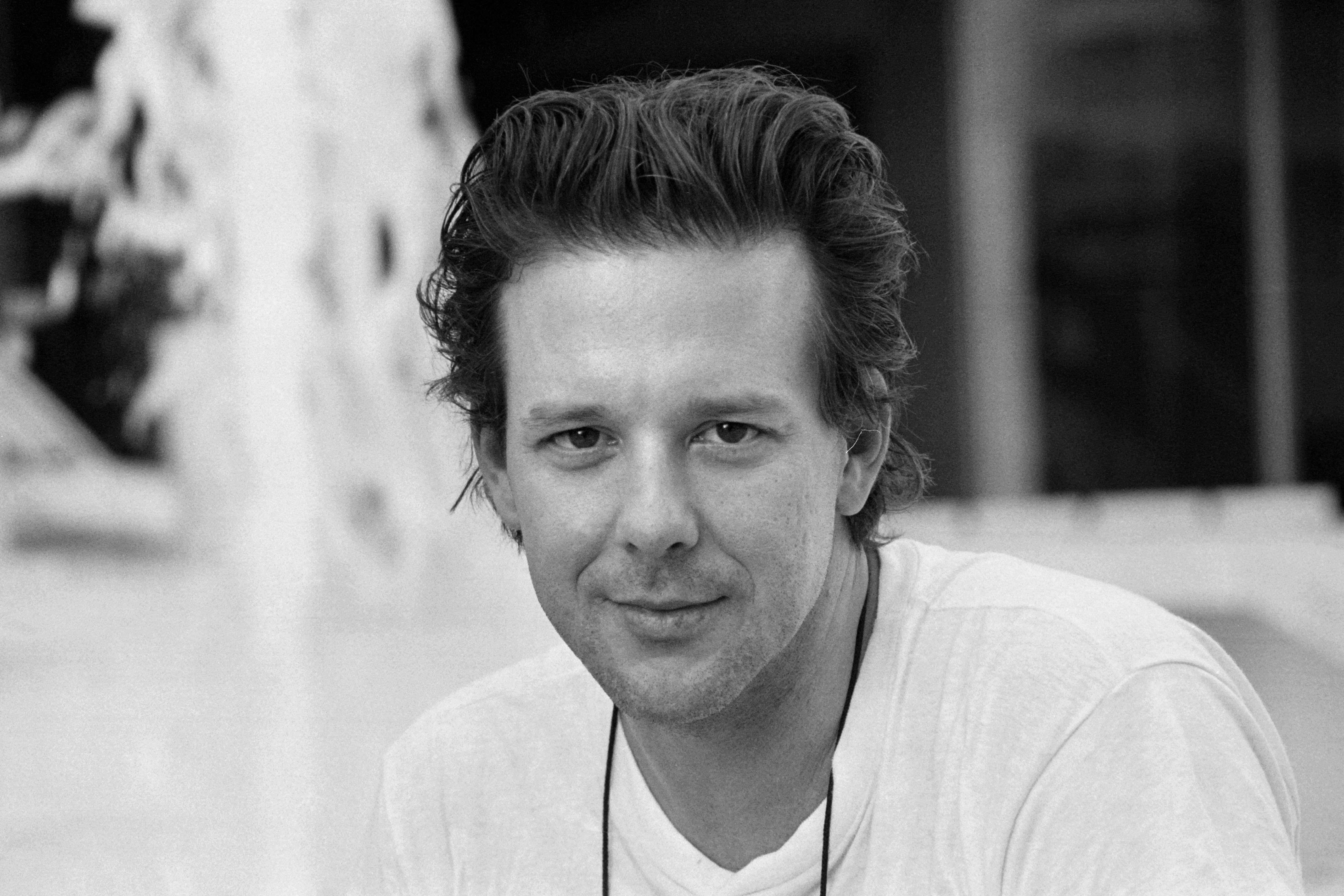 Following a screening of "Year of the Dragon" in Nice on October 10, 1985, Mickey Rourke sat for a black-and-white portrait with his hair swept away from his face and a casual white shirt completing the understated look. The Michael Cimino crime drama arrived as Rourke's profile continued to rise, capturing him on the cusp of the roles that would make his heartthrob status unmistakable.