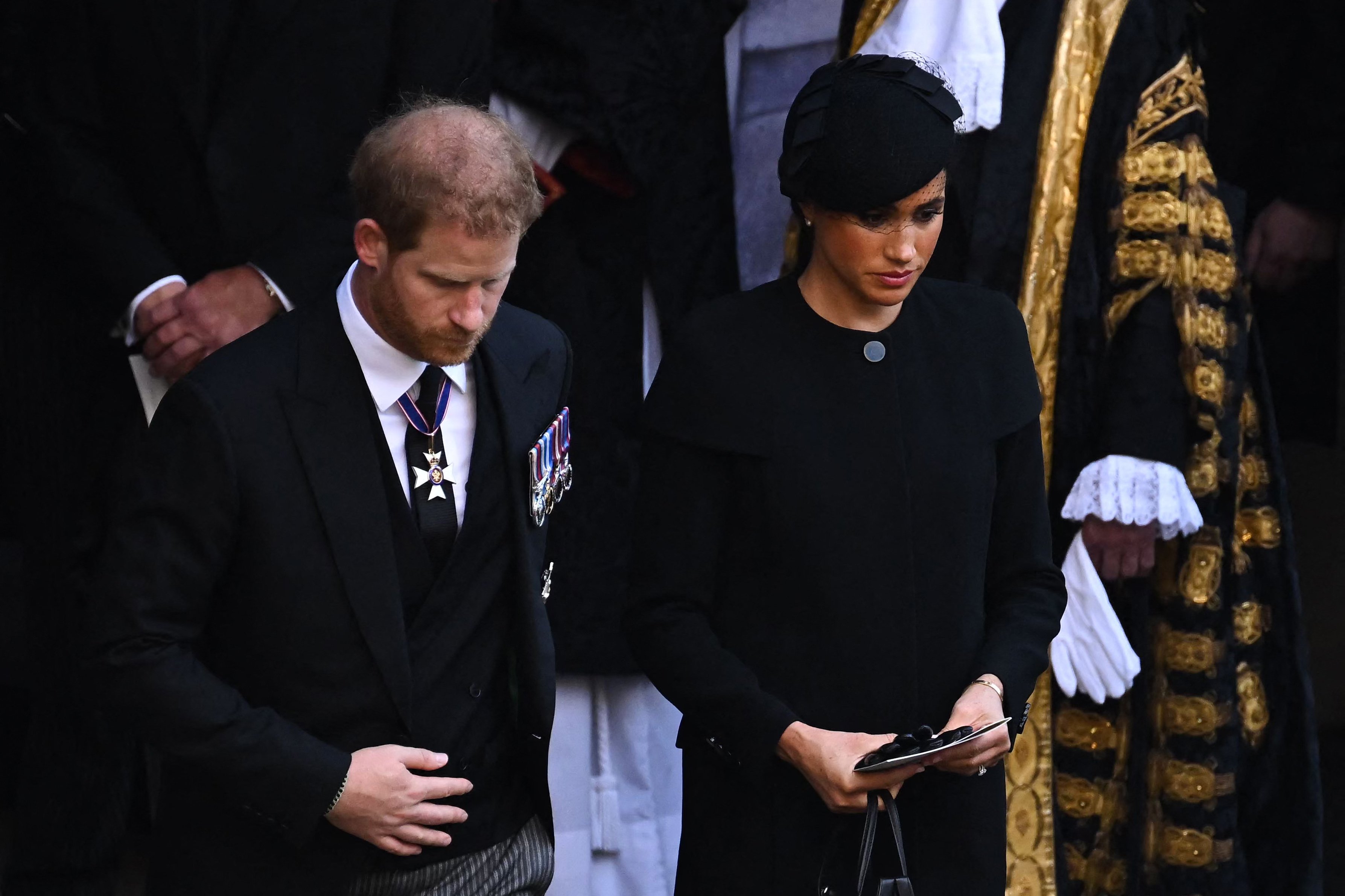 rince Harry, Duke of Sussex and Meghan, Duchess of Sussex leave after a service for the reception of Queen Elizabeth II's coffin at Westminster Hall, in the Palace of Westminster in London on September 14, 2022 | Source: Getty Images 