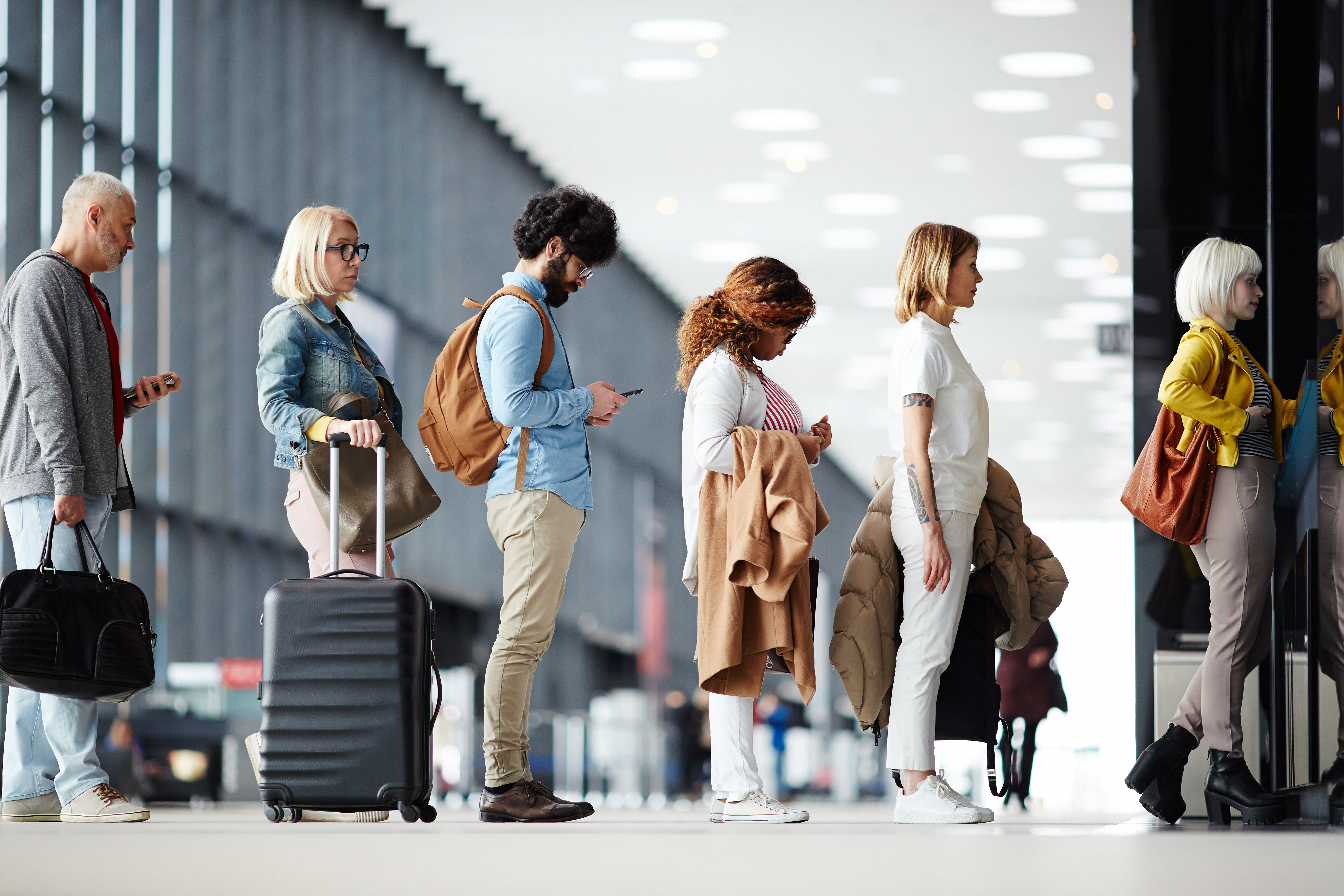People standing in line at an airport | Source: Shutterstock