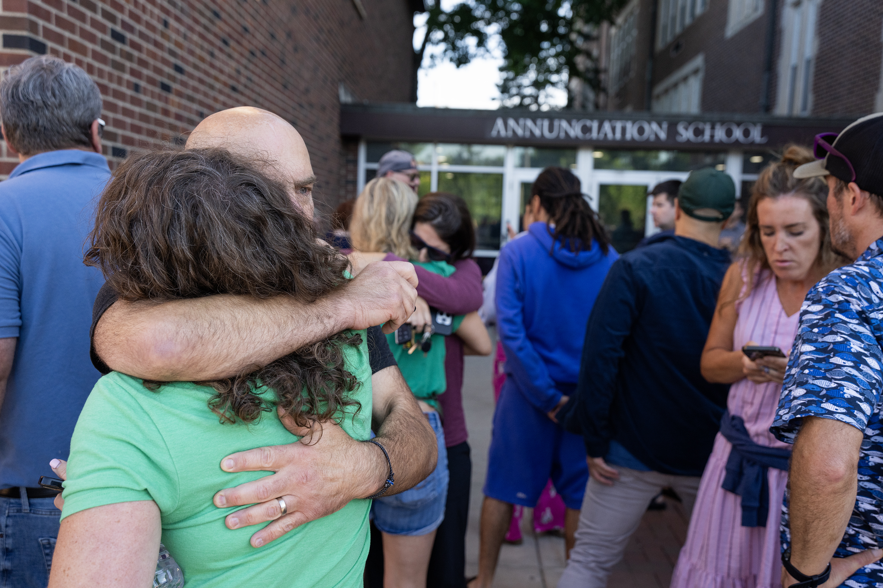 Parents at the Annunciation School in Minneapolis, Minnesota, on August 27, 2025. | Source: Getty Images