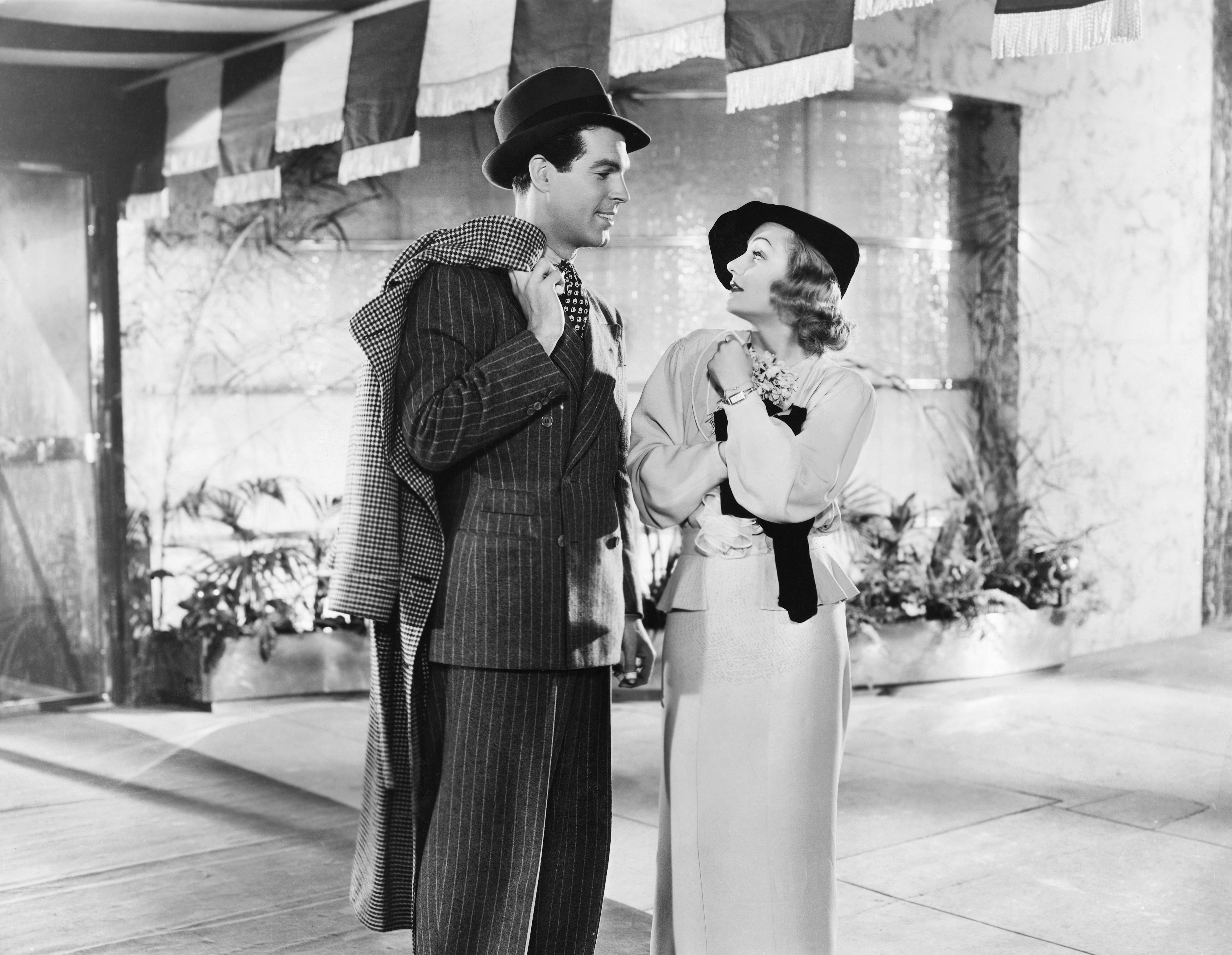 Fred MacMurray as Theodore Drew III and Carole Lombard as Regi Allen in the 1935 film Hands Across the Table. | Source: Getty Images