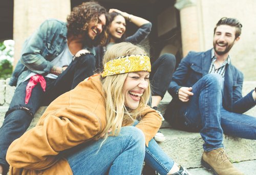 A group of friend laughing out loud. | Source: Shutterstock
