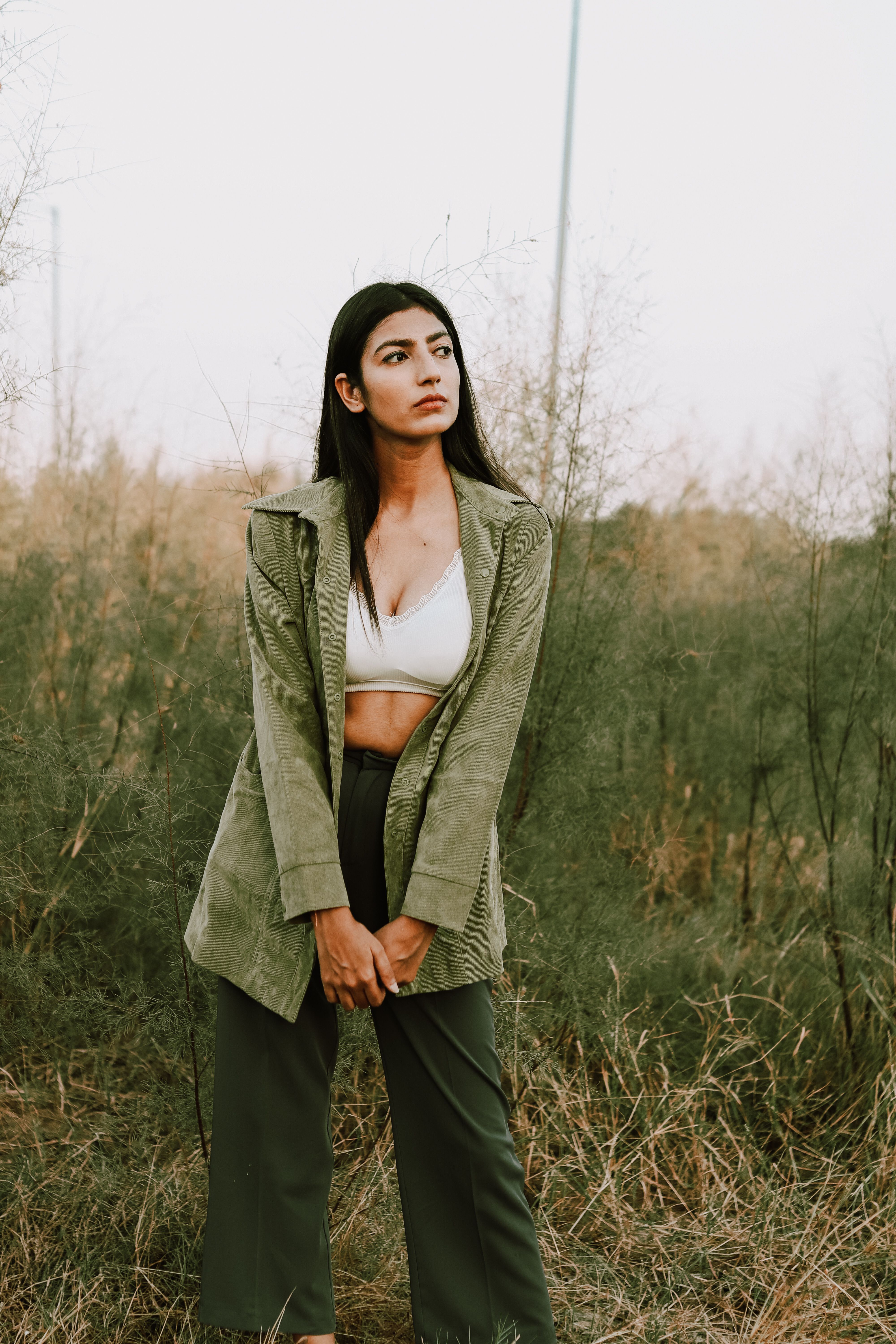 Woman dressed in earthly green tones | Source: Pexels