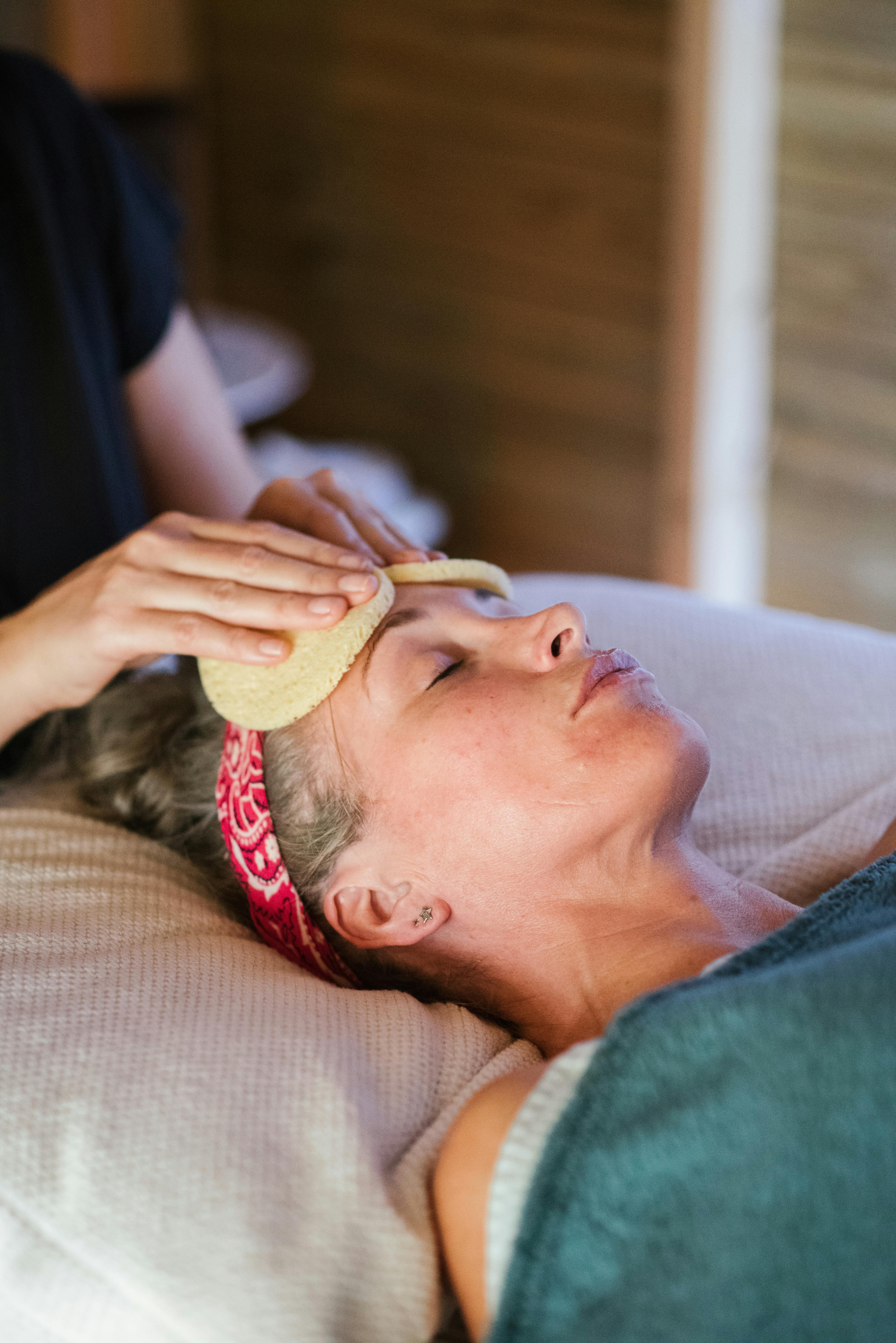 A relaxed woman getting a massage | Source: Pexels