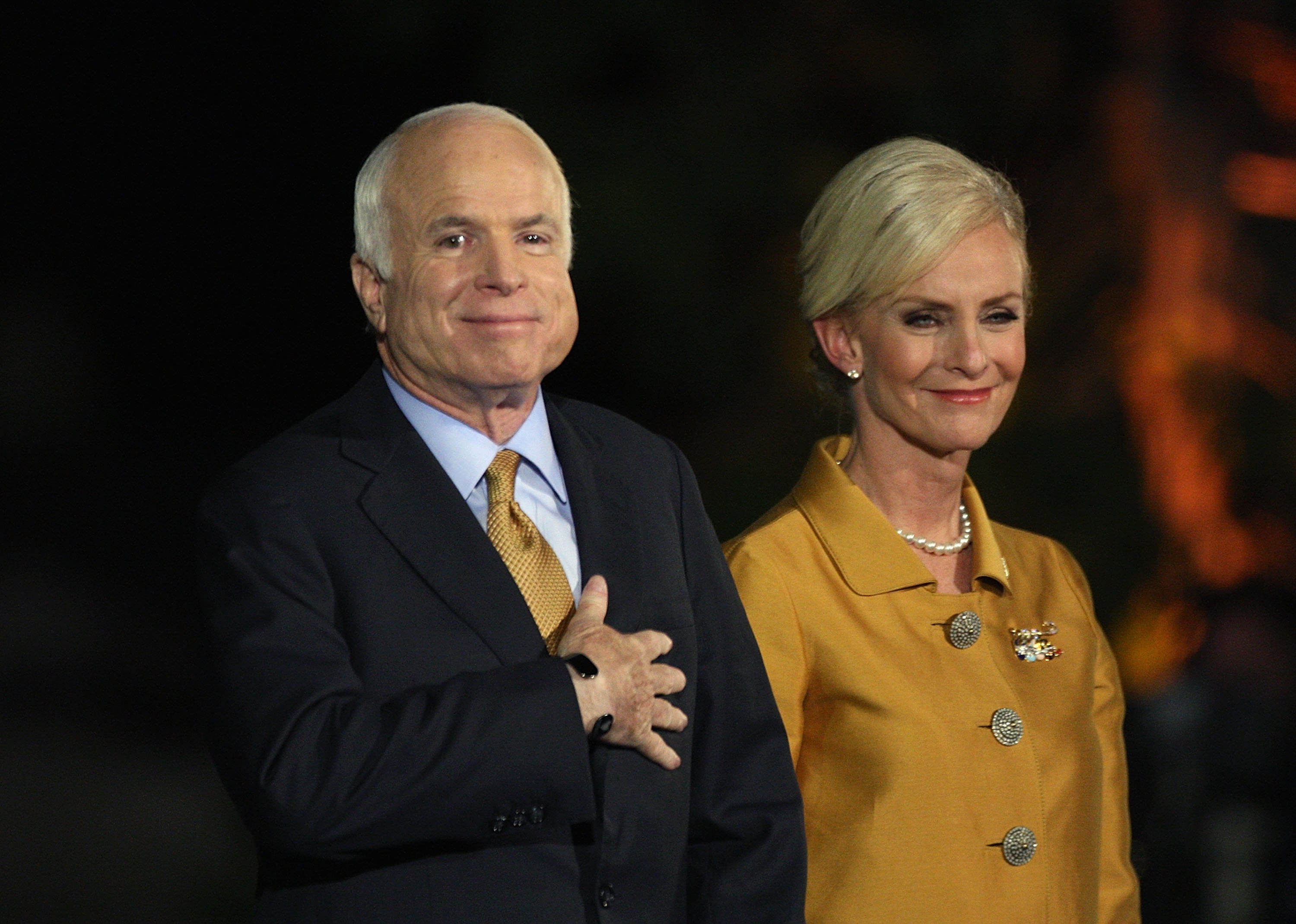 Late U.S. Sen. John McCain concedes victory on stage with his wife Cindy McCain during the election night rally in 2008. | Source: Getty Images