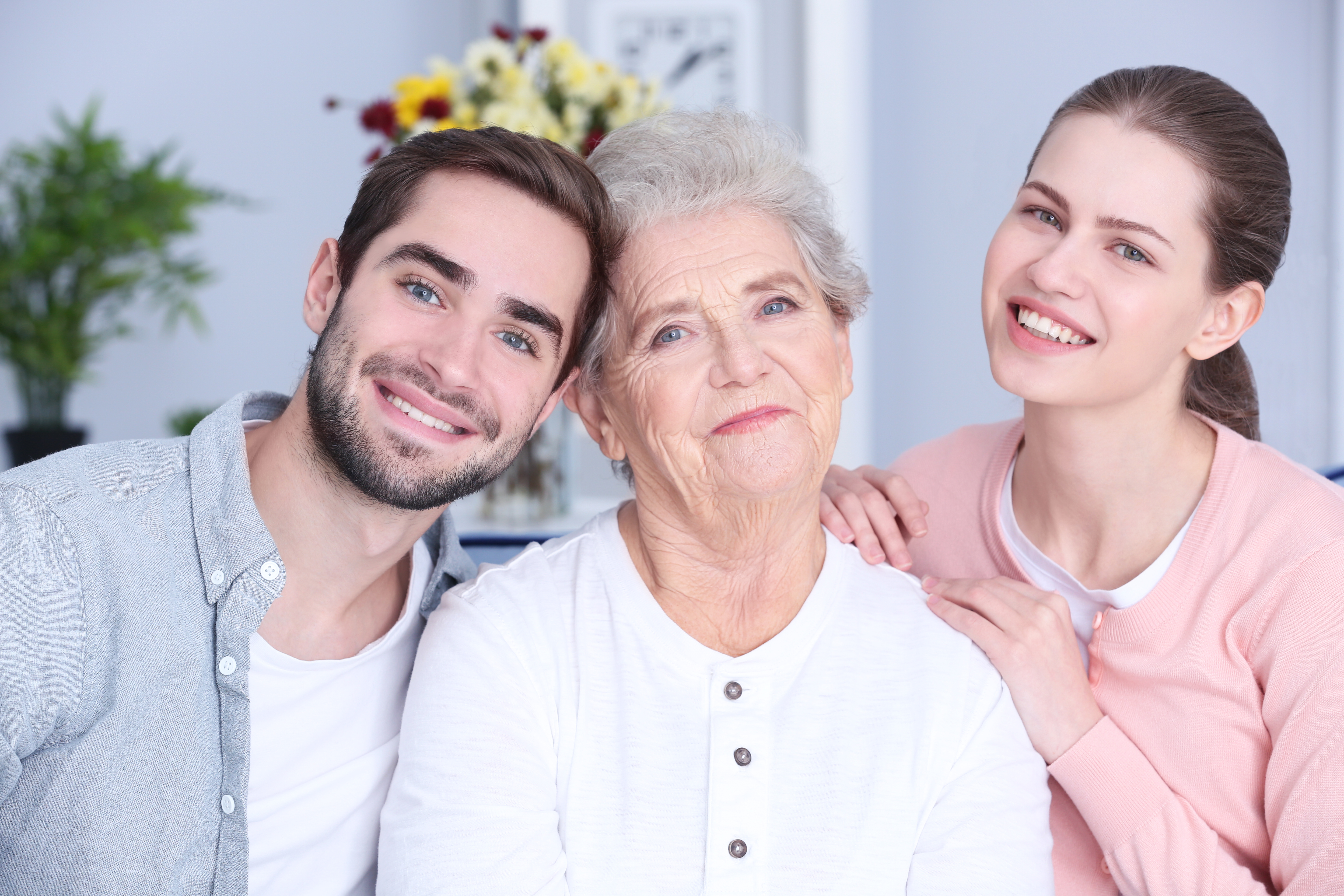 A senior woman with her son and daughter | Source: Shutterstock