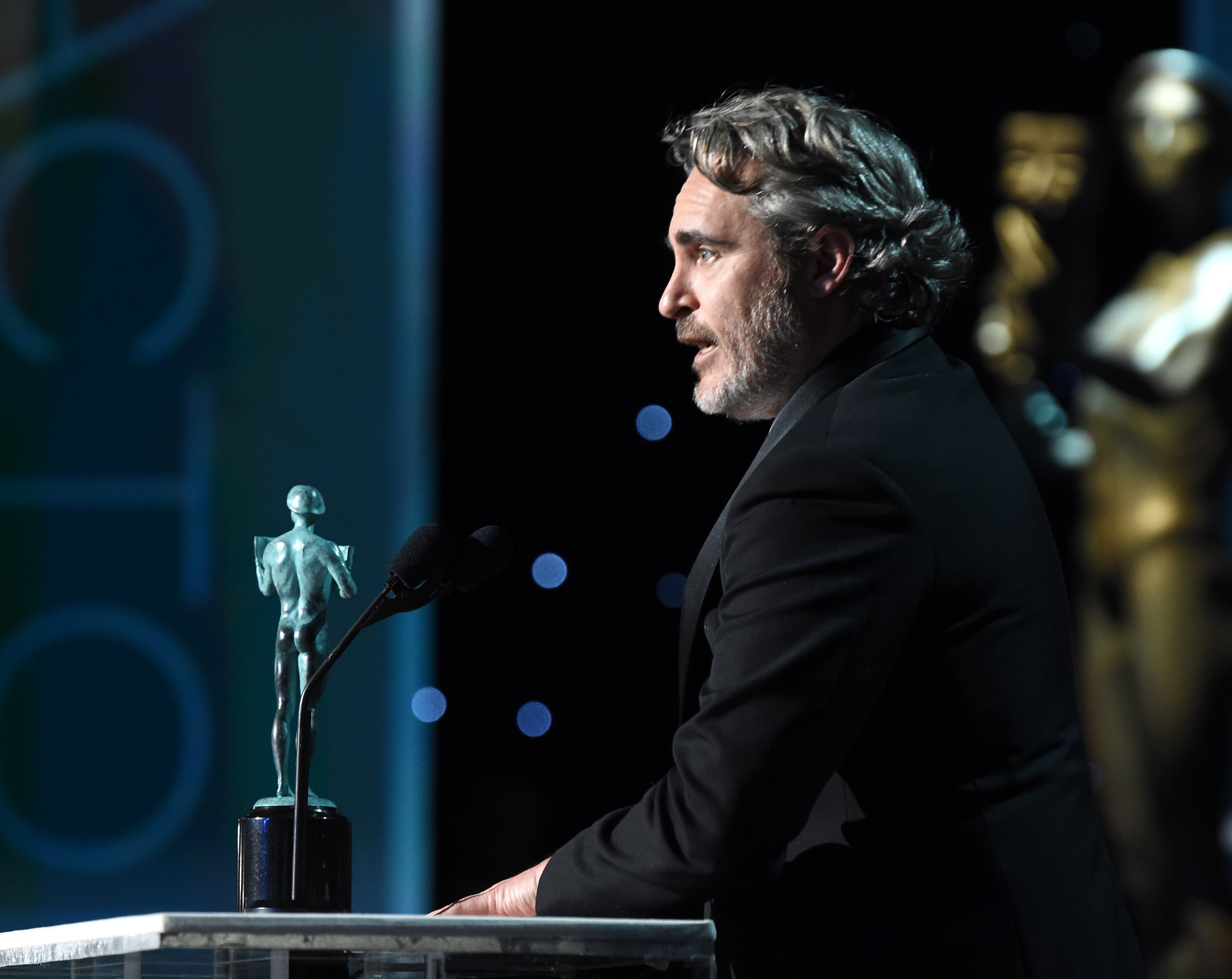 Joaquin Phoenix accepting an award for 'Joker' at the Annual Screen Actors Guild Awards on January 19, 2020 in Los Angeles. | Source: Getty Images