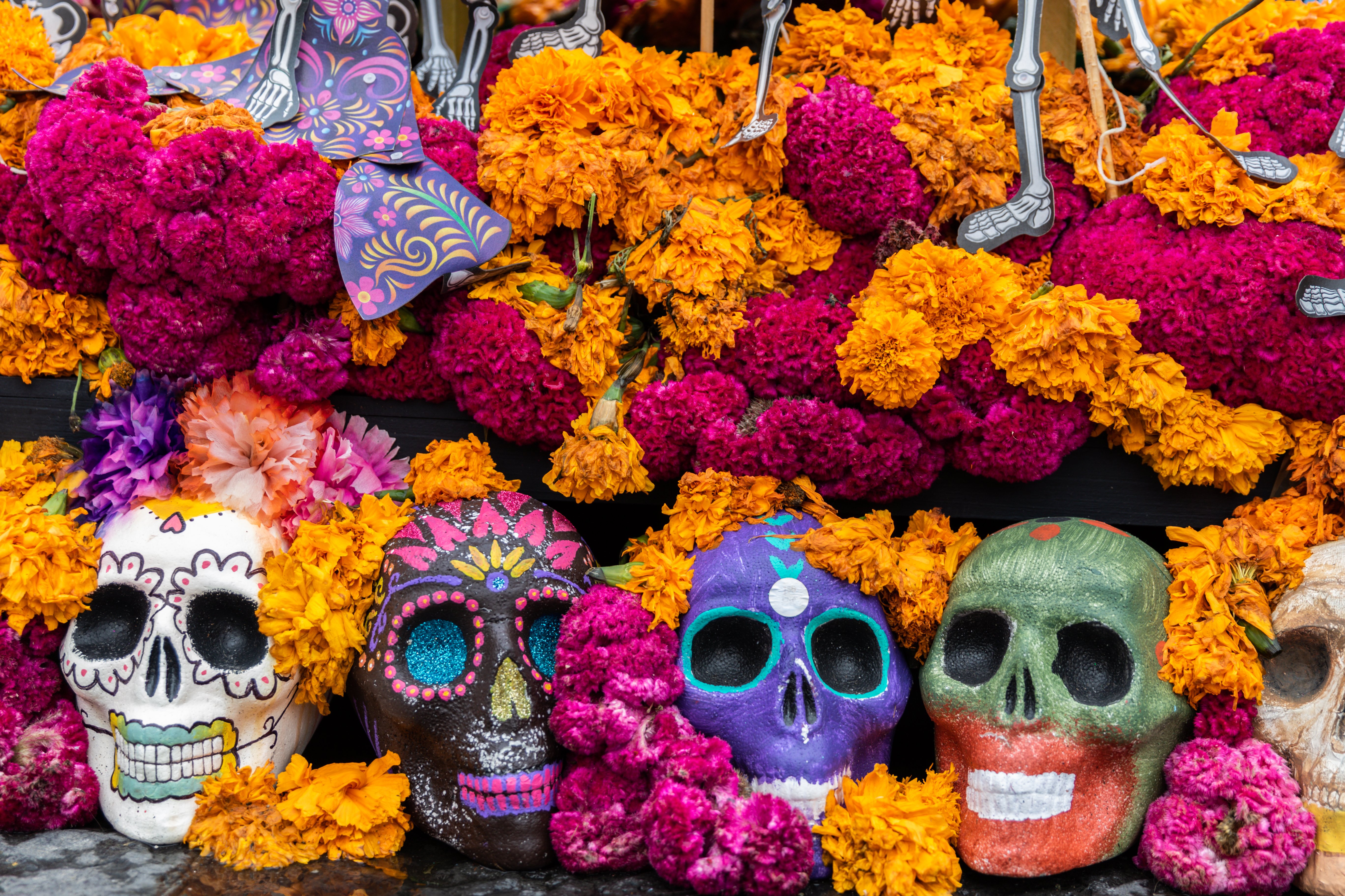 Marigold flowers and skulls in Day of the Dead celebrations altar decorations in Mexico City. | Source: Getty Images