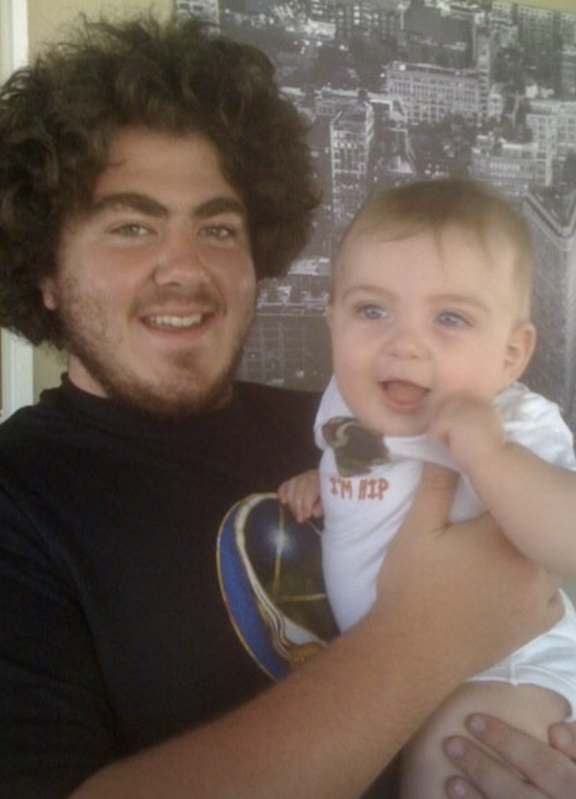 Hilary Wendt's brother holding a child | Source: Instagram Story/hillypoo