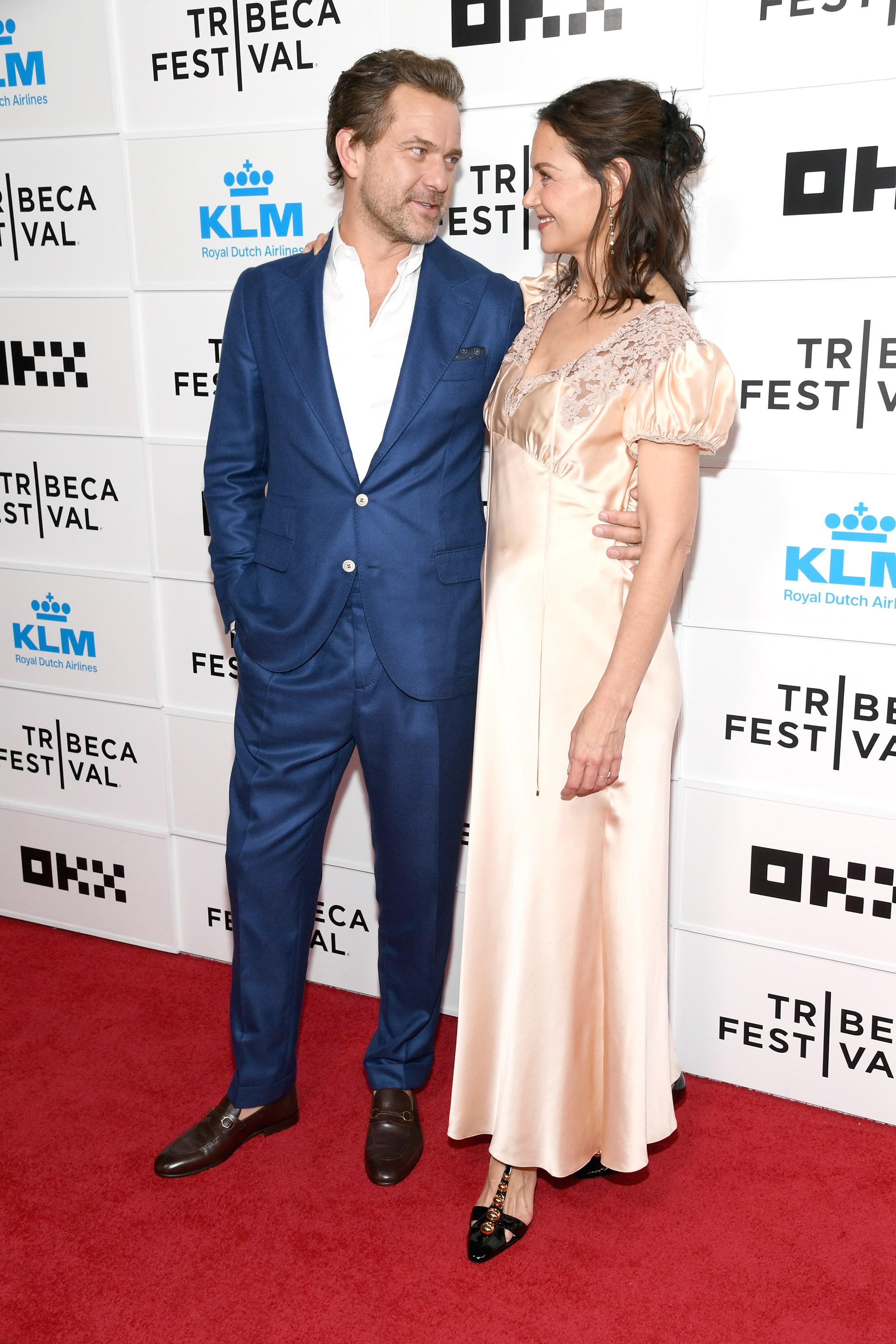 Joshua Jackson and Katie Holmes share a moment on the red carpet at the "Happy Hours" premiere during the 2026 Tribeca Festival in New York City. | Source: Getty Images