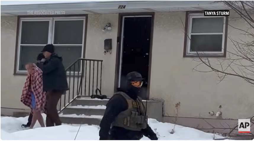 ICE agents lead ChongLy "Scott" Thao out of his house, from a post dated January 20, 2026 | Source: Youtube/AssociatedPress