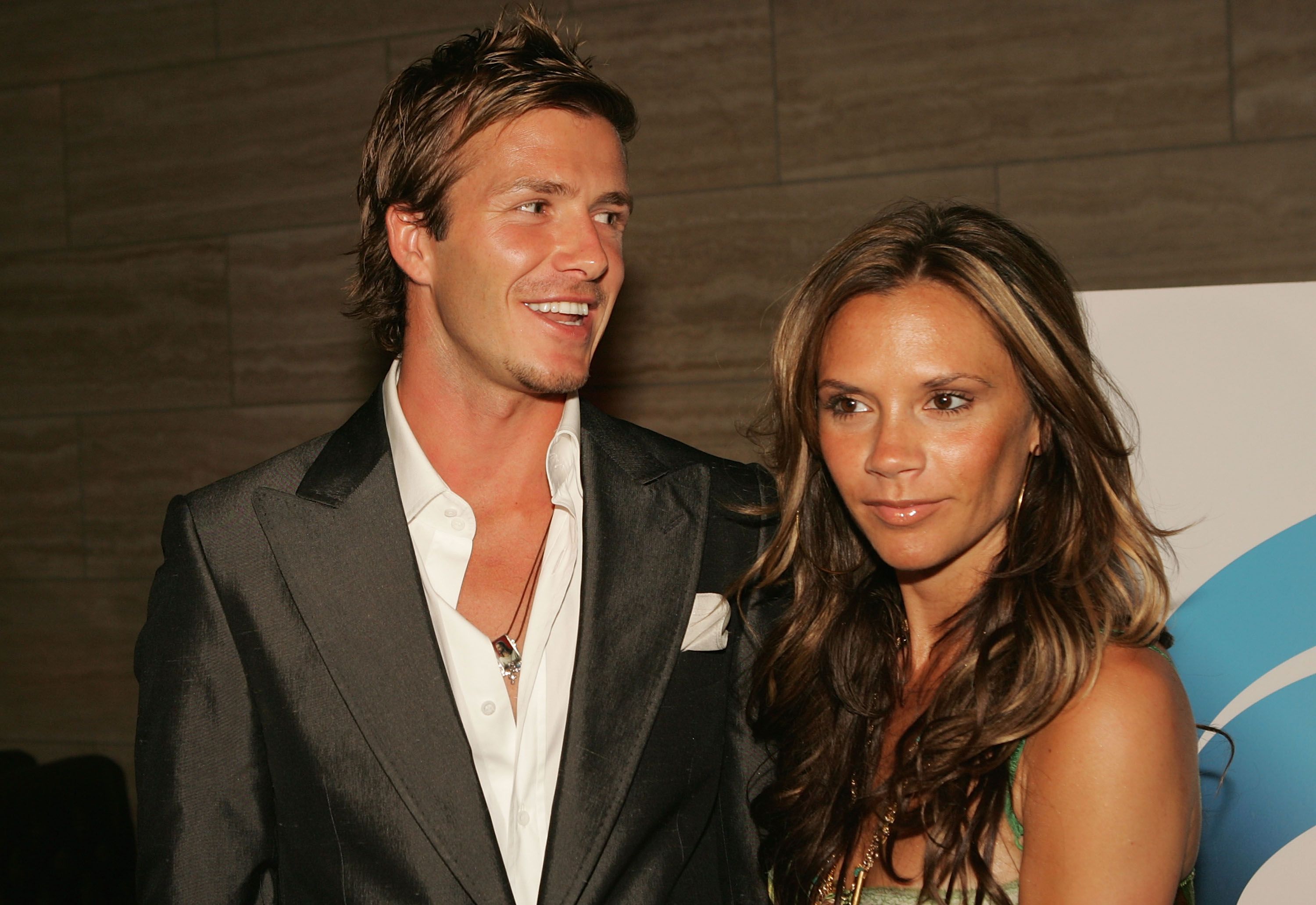David Beckham and wife Victoria pose at "The David Beckham Academy" launch party at Creative Artists Agency on June 3, 2005 in Beverly Hills, California. | Source: Getty Images