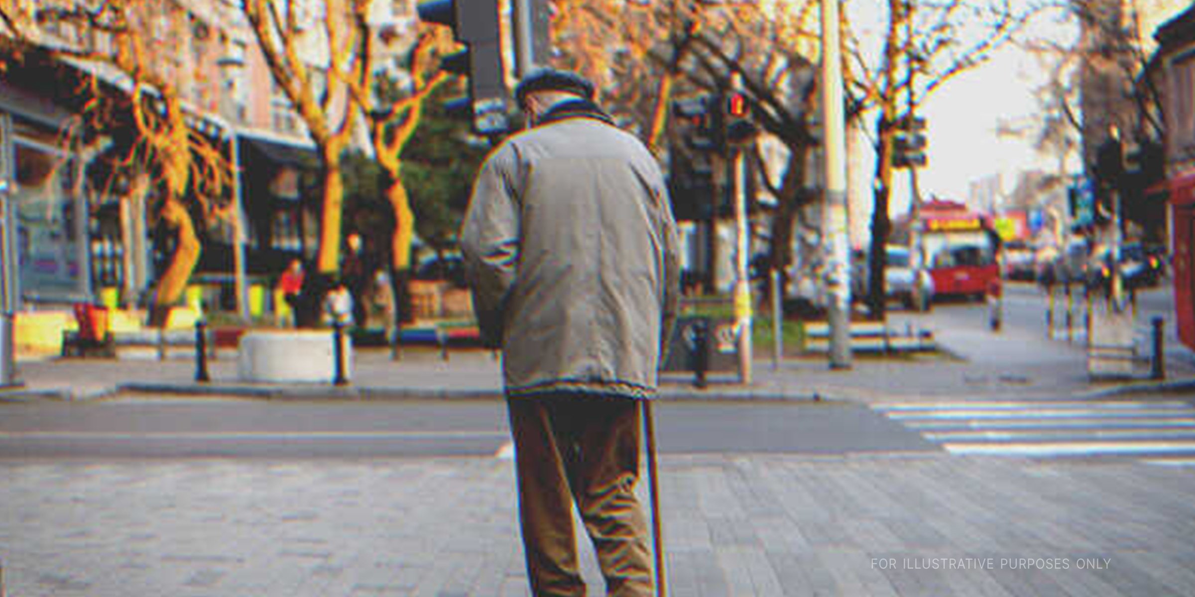 Old man with cane walking on the street. | Shutterstock