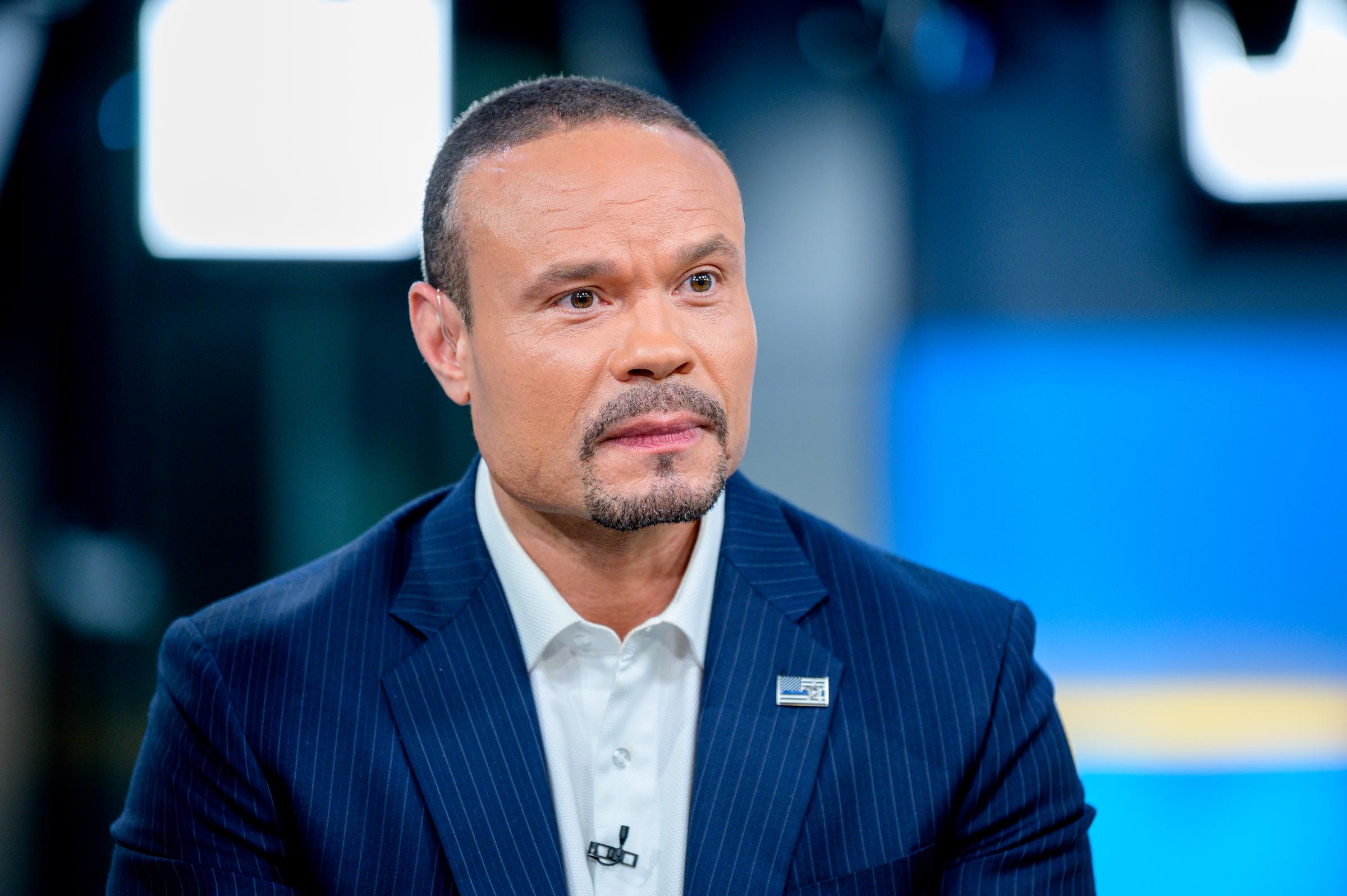 Dan Bongino as US Open winner Gary Woodland visits "FOX & Friends" at Fox News Channel Studios on June 18, 2019. | Source: Getty Images