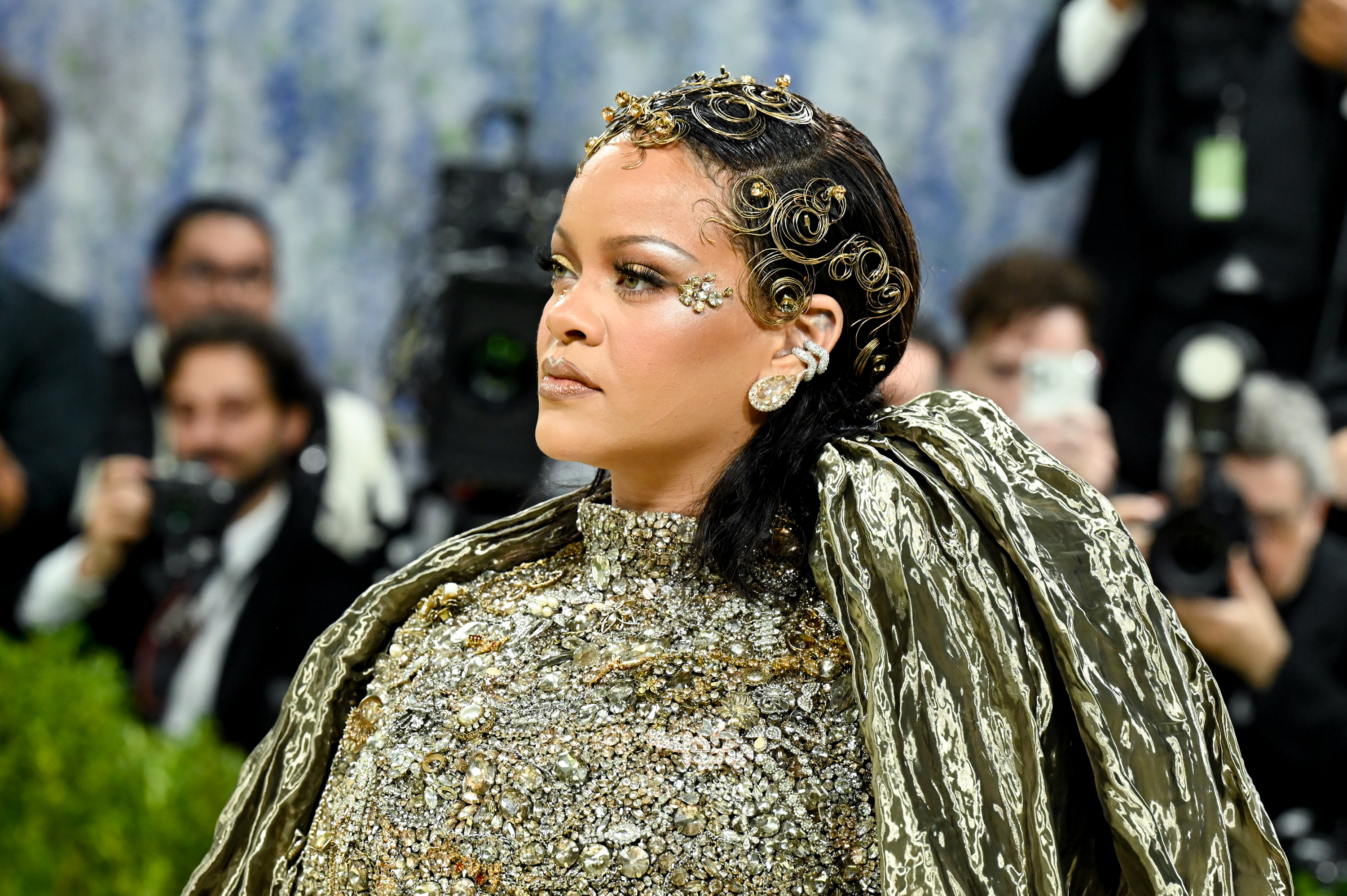 Rihanna appears in a bold, textured ensemble at the Met Gala | Source: Getty Images