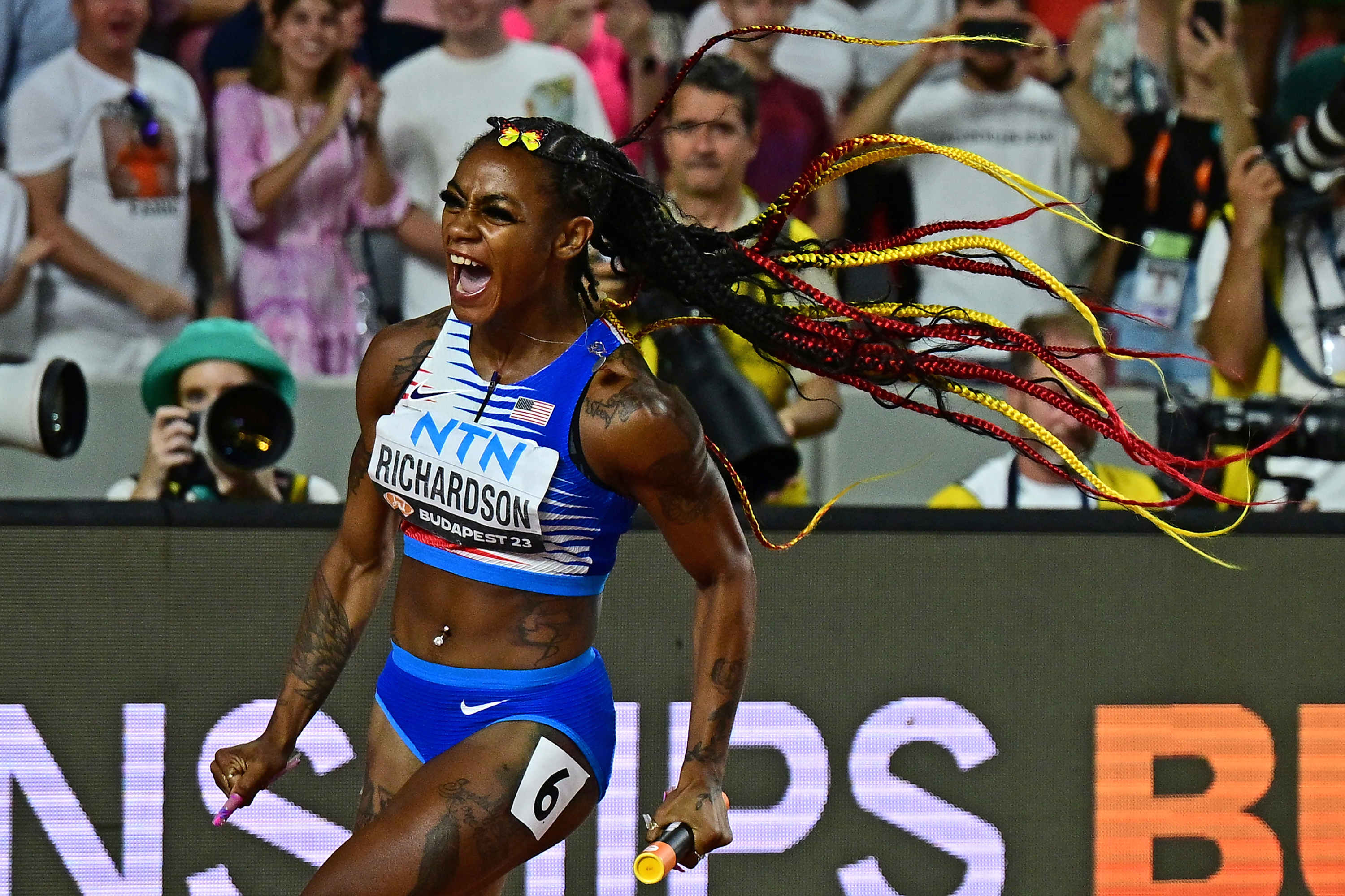 ShaCarri Richardson celebrating as she crossed the finishing line of the Womens 4x100-meter Relay Final during the World Athletics Championships on August 26, 2023, in Budapest, Hungary. | Source: Getty Images