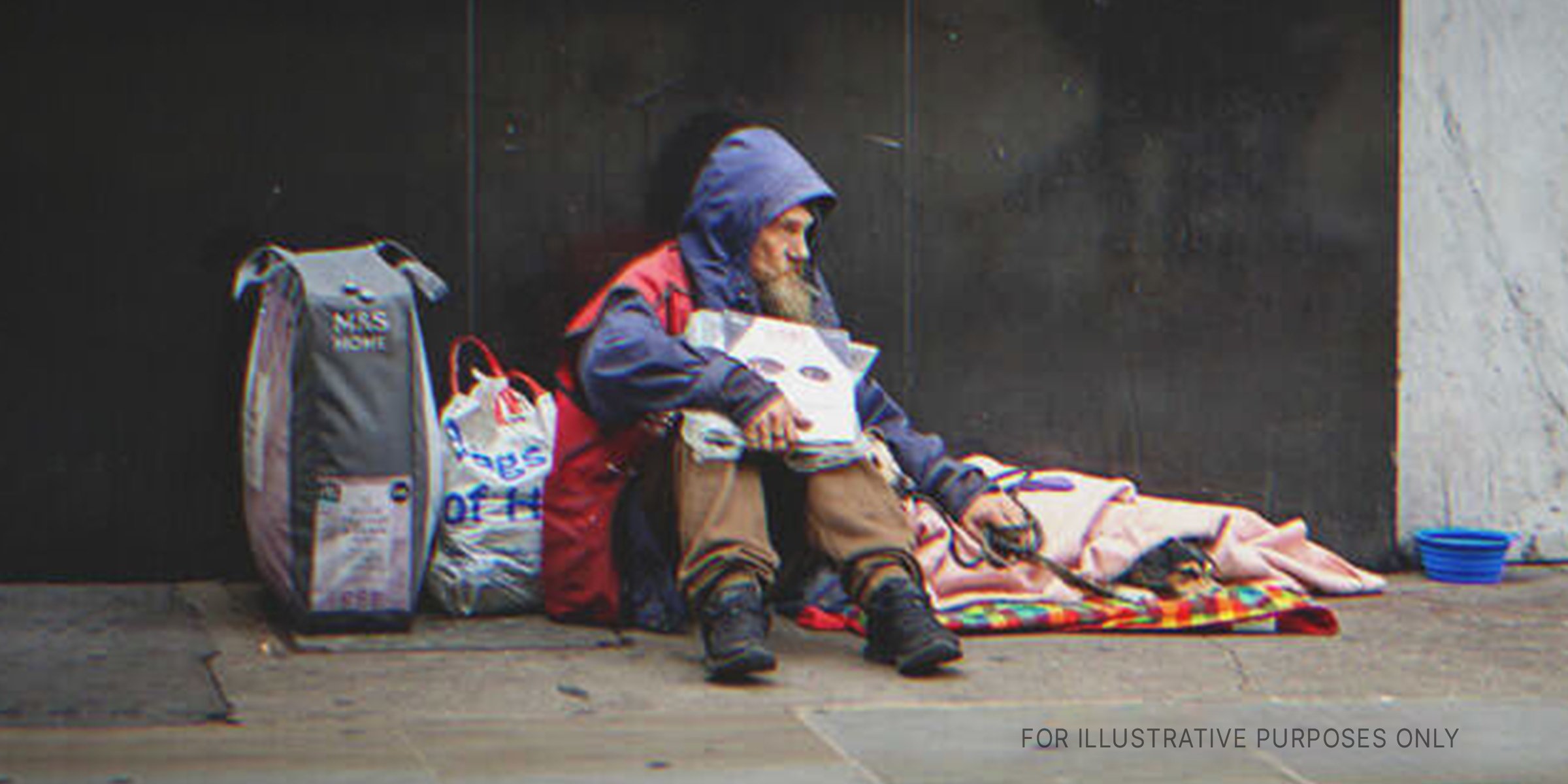Homeless Man Sitting On A Pavement. | Source: Shutterstock