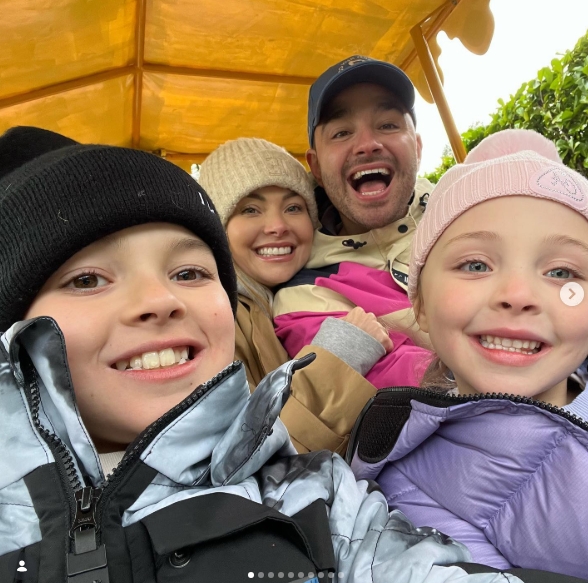 Shared on 9 April 2024, Caroline and Adam Thomas are all smiles in a cheerful family selfie with their two children, bundled up in cosy jackets and hats — a joyful snapshot that captures their close-knit bond and playful energy during a day out together. | Source: Instagram/carolinethomas23