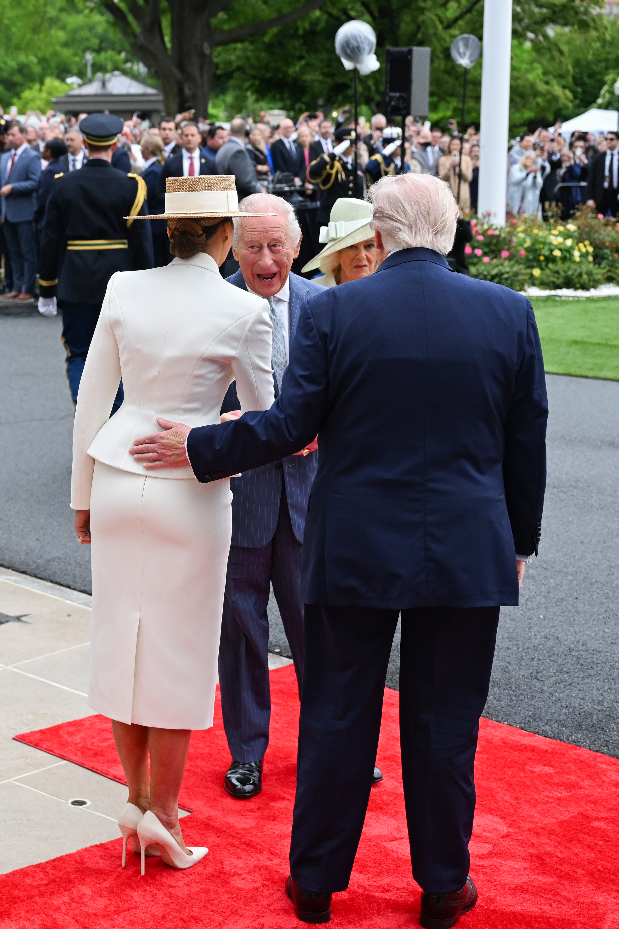 Donald Trump and Melania Trump greet King Charles III and Queen Camilla during the State Arrival Ceremony on the White House South Lawn, April 28, 2026. | Source: Getty Images