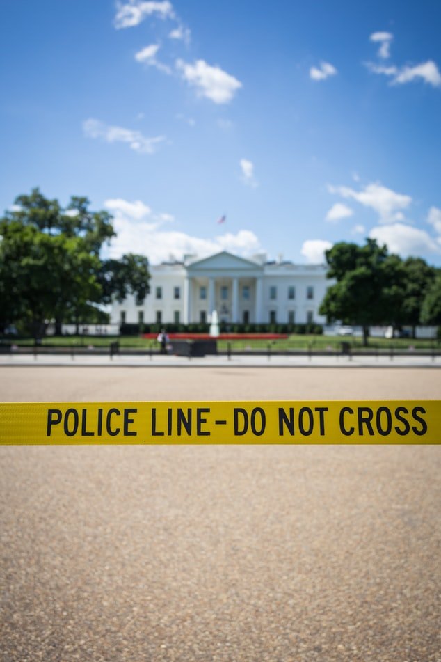 A yellow police line to keep people away from a scene | Photo: Unsplash