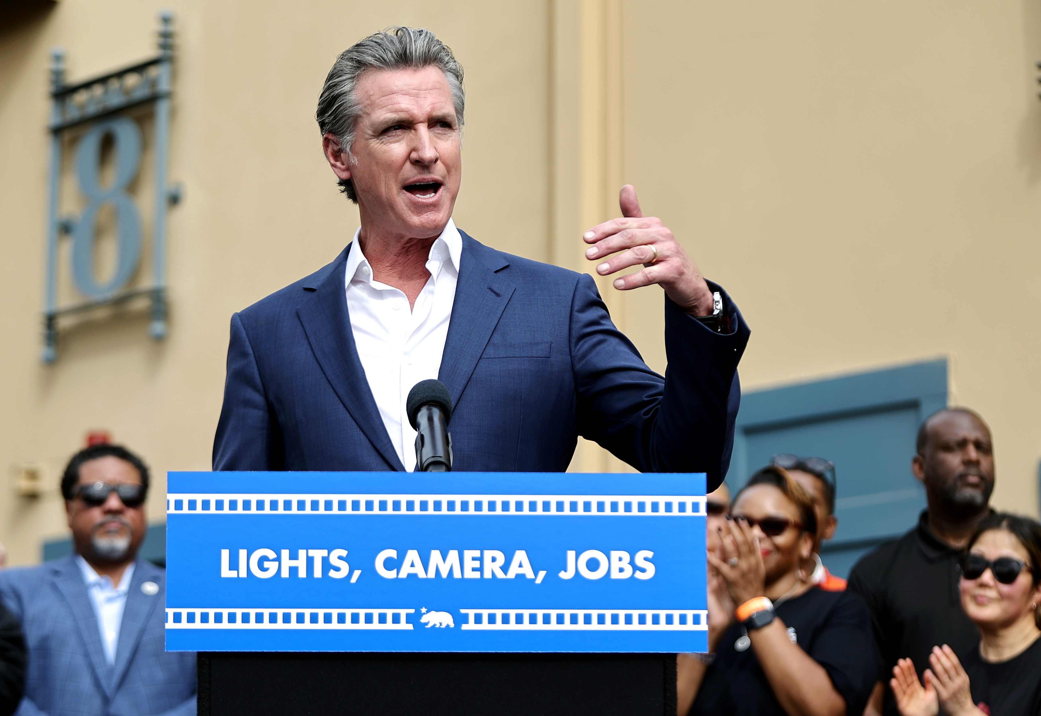 Governor Gavin Newsom speaking at a press conference at Raleigh Studios in Los Angeles, California on October 27, 2024 | Source: Getty Images