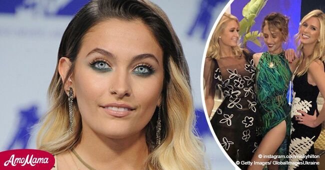 Paris Jackson puts on a dazzling display as she flaunts her toned legs in a skintight slit gown