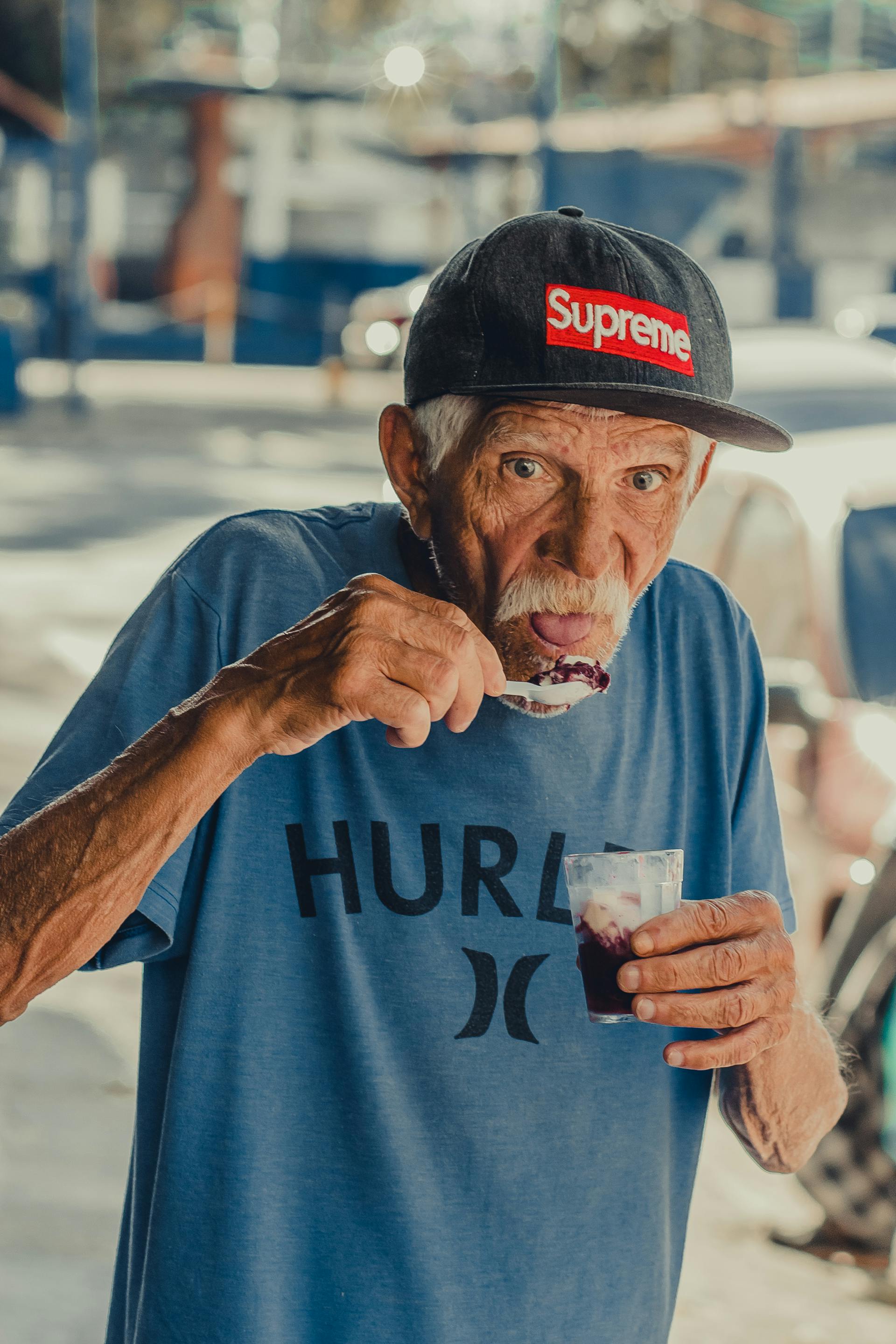 An elderly man eating an ice cream | Source: Pexels