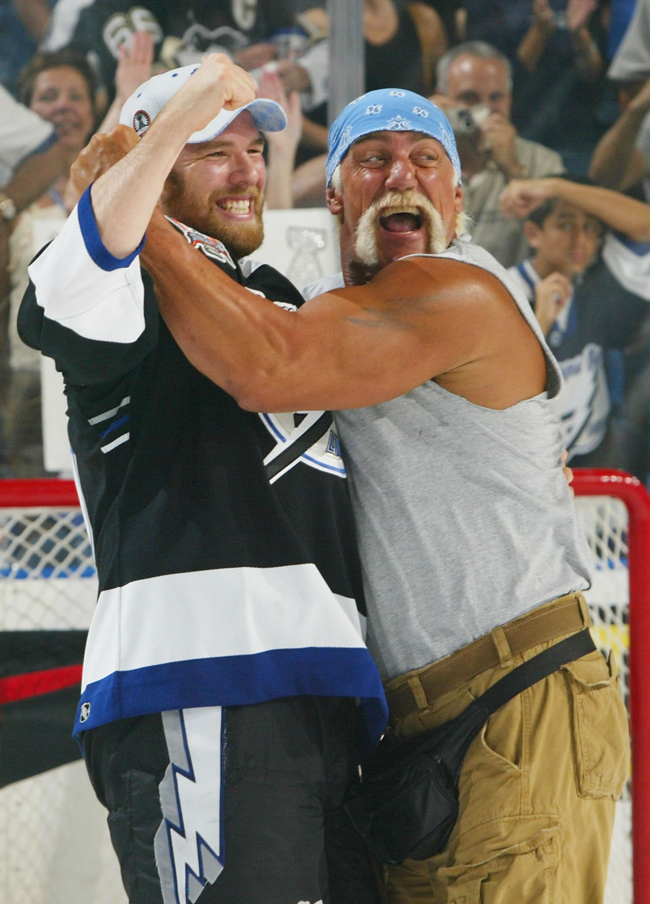 Andre Roy of the Tampa Bay Lightning celebrating with Hulk Hogan after defeating the Calgary Flames 2-1 to win the Stanley Cup in game seven of the NHL Stanley Cup Finals on June 7, 2004, at the St. Pete Times Forum in Florida. | Source: Getty Images