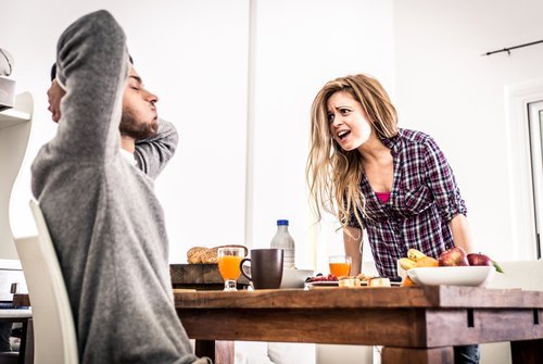 A young couple fighting at the breakfast table. | Source: Shutterstock.