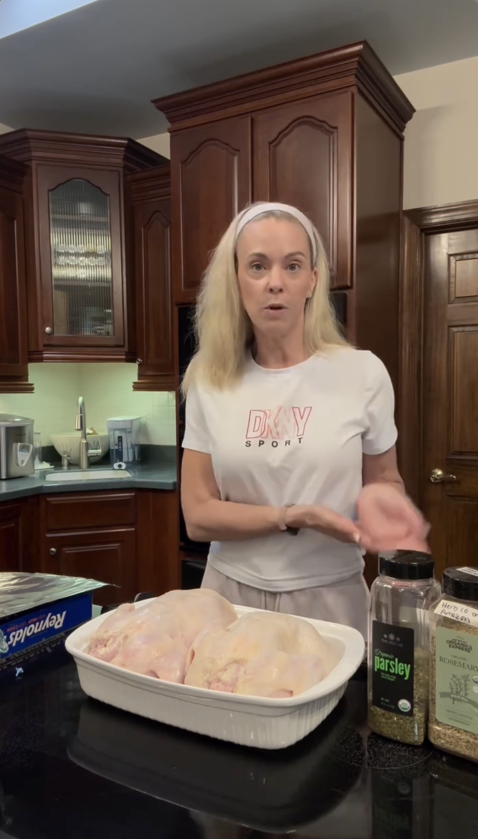 In her kitchen, Kate Gosselin presents whole raw chickens and large containers of parsley and rosemary as part of a step-by-step video tutorial showing how she prepares homemade meals specifically for her dogs. | Source: Instagram/kateplusmy8