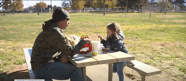 Brian Zach and his adopted daughter Kaila eating together | Photo: YouTube/ABC15 Arizona