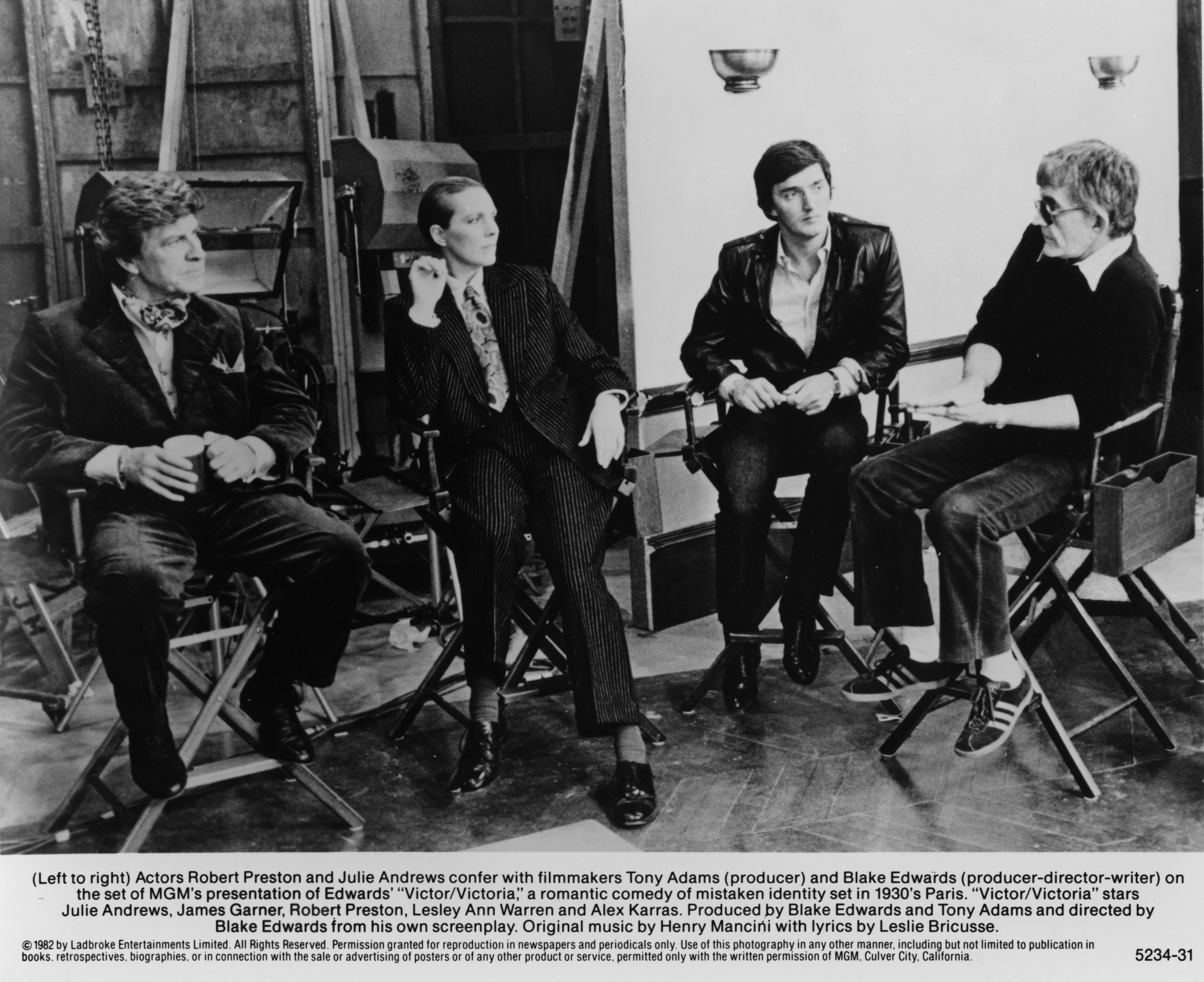 Robert Preston, Julie Andrews, Tony Adams, and Blake Edwards on the set of "Victor/Victoria," circa 1982. | Source: Getty Images
