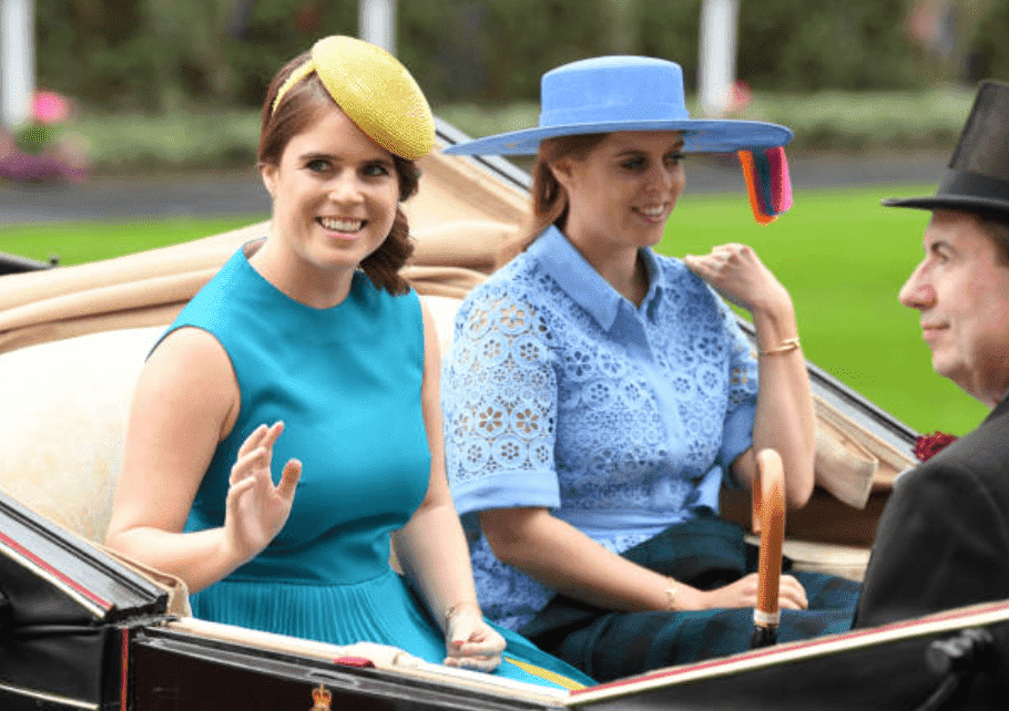 Princess Eugenie and her sister Princess Beatrice wave to crowds while sitting in a carriage at the Royal Ascot at Ascot Racecourse, on June 18, 2019, in Ascot, England |Source: Getty Images (Photo by Karwai Tang/WireImage)