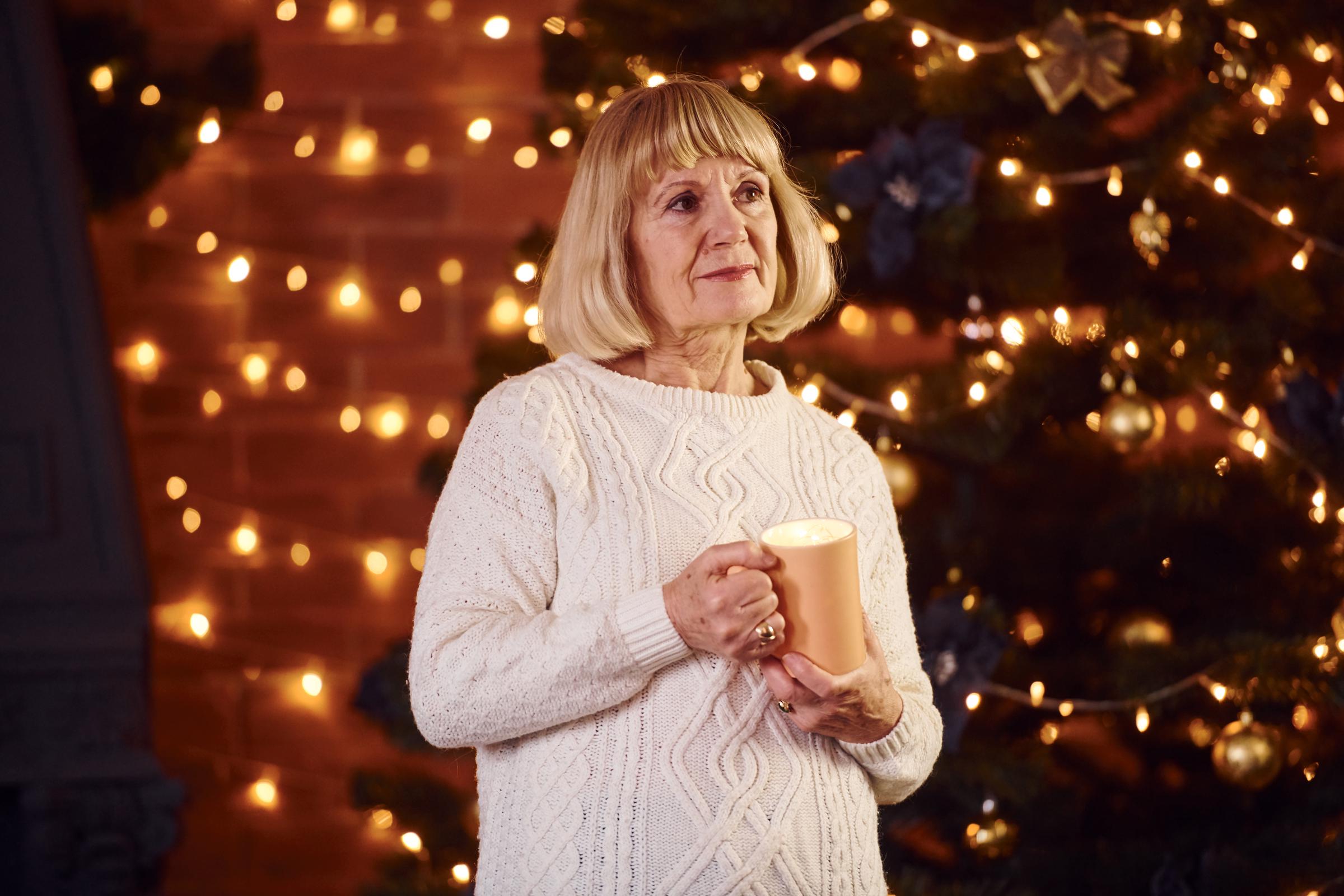 Woman contemplating during the Christmas holiday | Source: Shutterstock