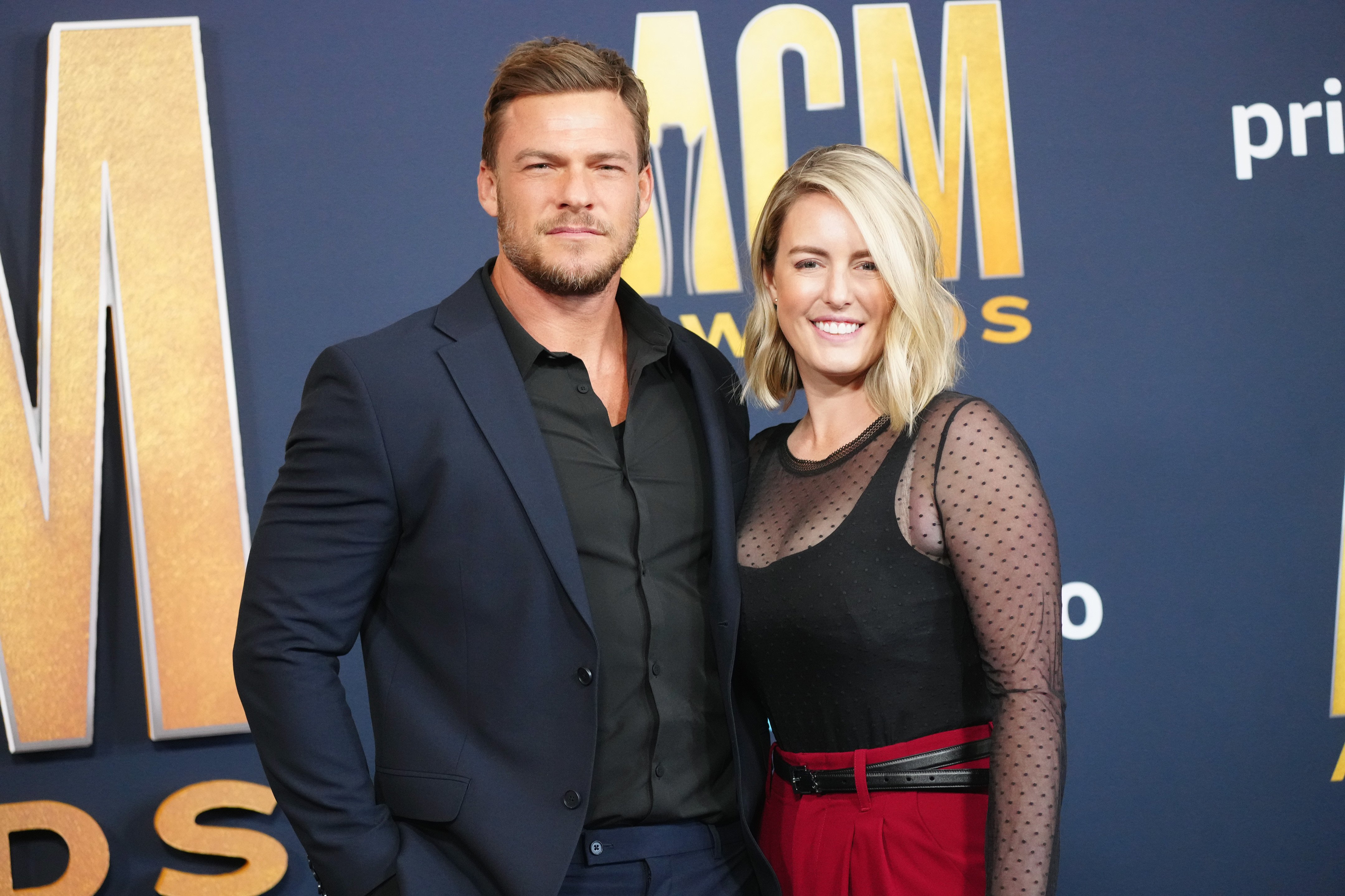 Catherine Ritchson and Alan Ritchson attend the 57th Academy of Country Music Awards at Allegiant Stadium, on March 7, 2022, in Las Vegas, Nevada. | Source: Getty Images