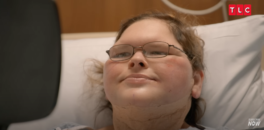 With the bandages gone, Tammy studies her reflection, visibly emotional, from a video posted on June 11, 2025 | Source: YouTube/AccessHollywood