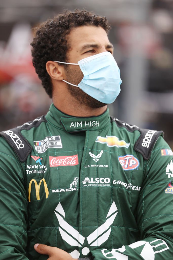 Bubba Wallace, stands on the grid prior to the NASCAR Cup Series Coca-Cola 600 at Charlotte Motor Speedway in May 2020 in Concord, North Carolina | Photo: Getty Images
