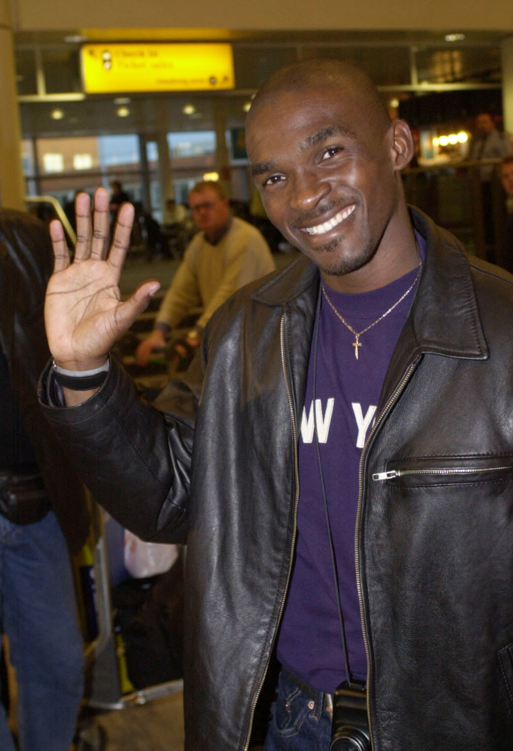 Eric "the Eel" Moussambani at Heathrow Airport to present a prize at the sixth National Television Awards on October 10, 2000, in London | Source: Getty Images