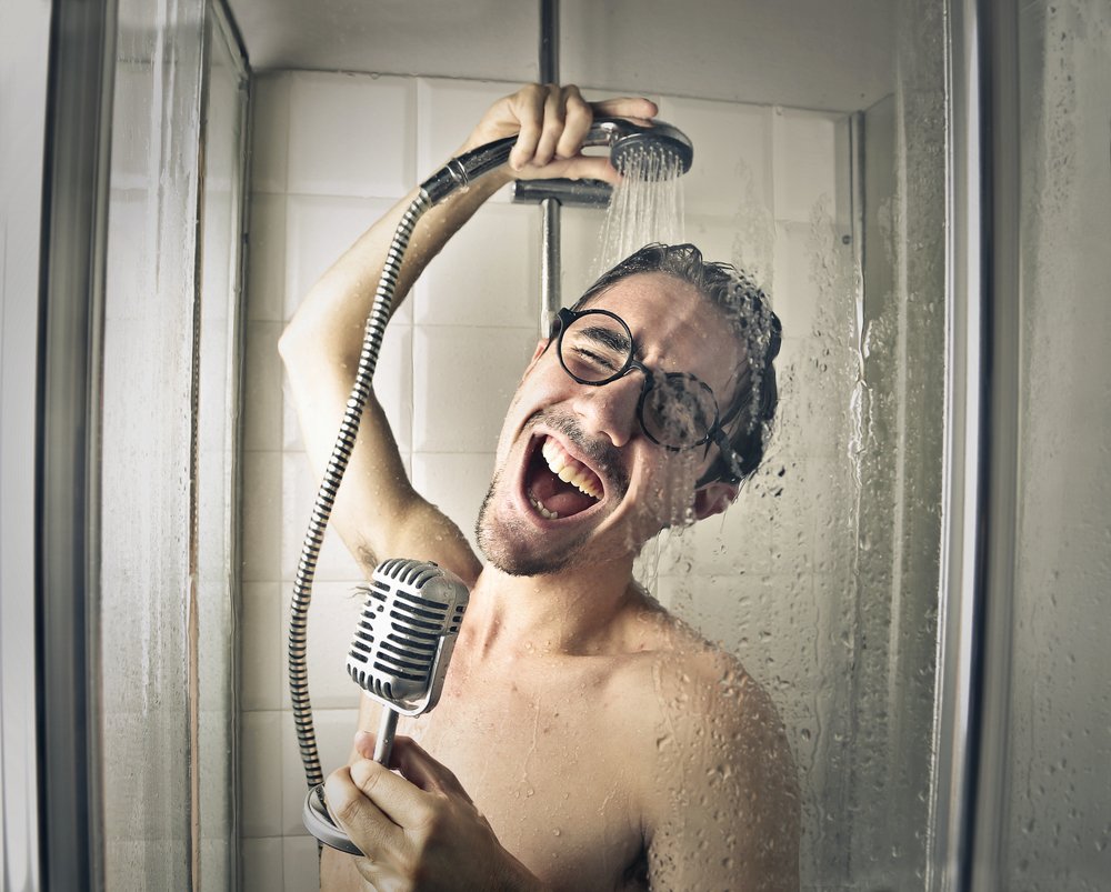 A photo of a man singing in the shower. | Photo: Shutterstock