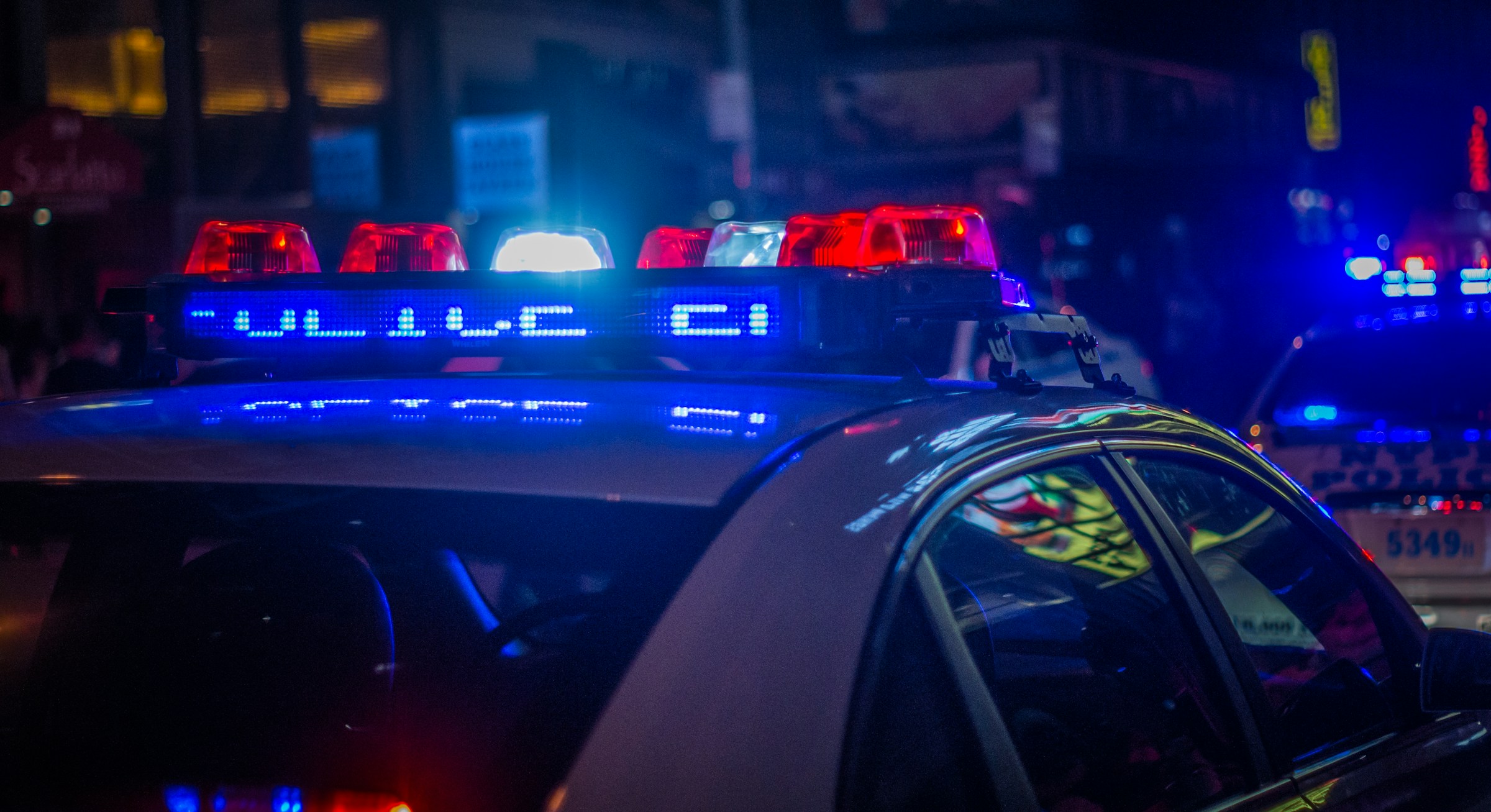 Close-up of police cars on the street at night | Source: Unsplash