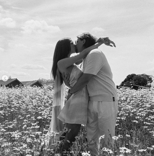 Jesse Light and Jesse Bongiovi sharing a kiss during their five-day wedding celebration, posted on July 15, 2024 | Source: Instagram/vogueweddings