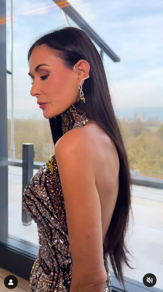 Demi Moore posing in Brad Goreski's video, which showcased her gown, posted on February 16, 2025. | Source: Instagram/bradgoreski